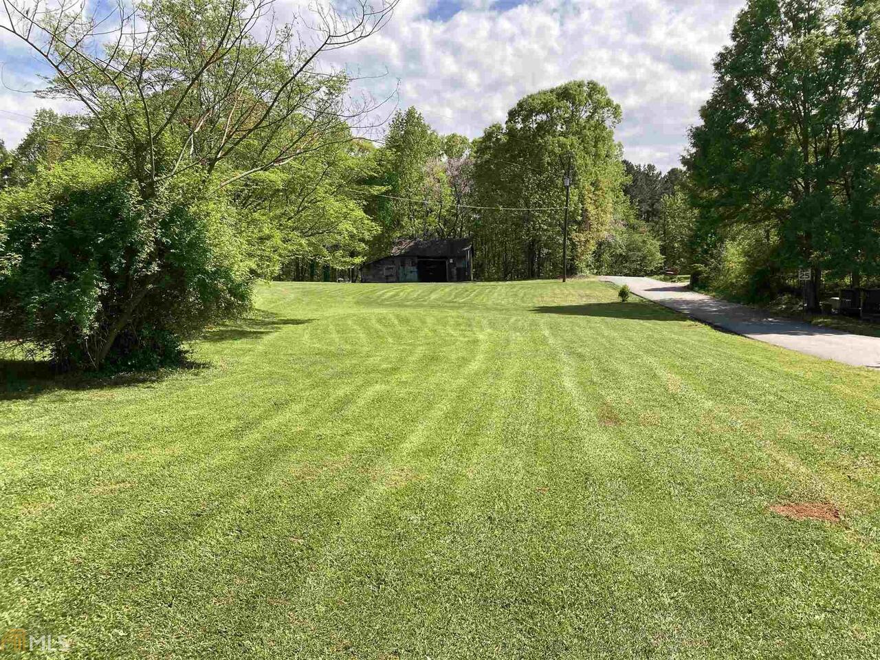 2.77 acres with road frontage on 2 roads and all utilities available. Water meter already on property. Can be divided into 3 buildable lots. Soil test already completed. Nice barn on land. Lots of possibilities. Convenient location to schools, shopping, hospital but feels far away!