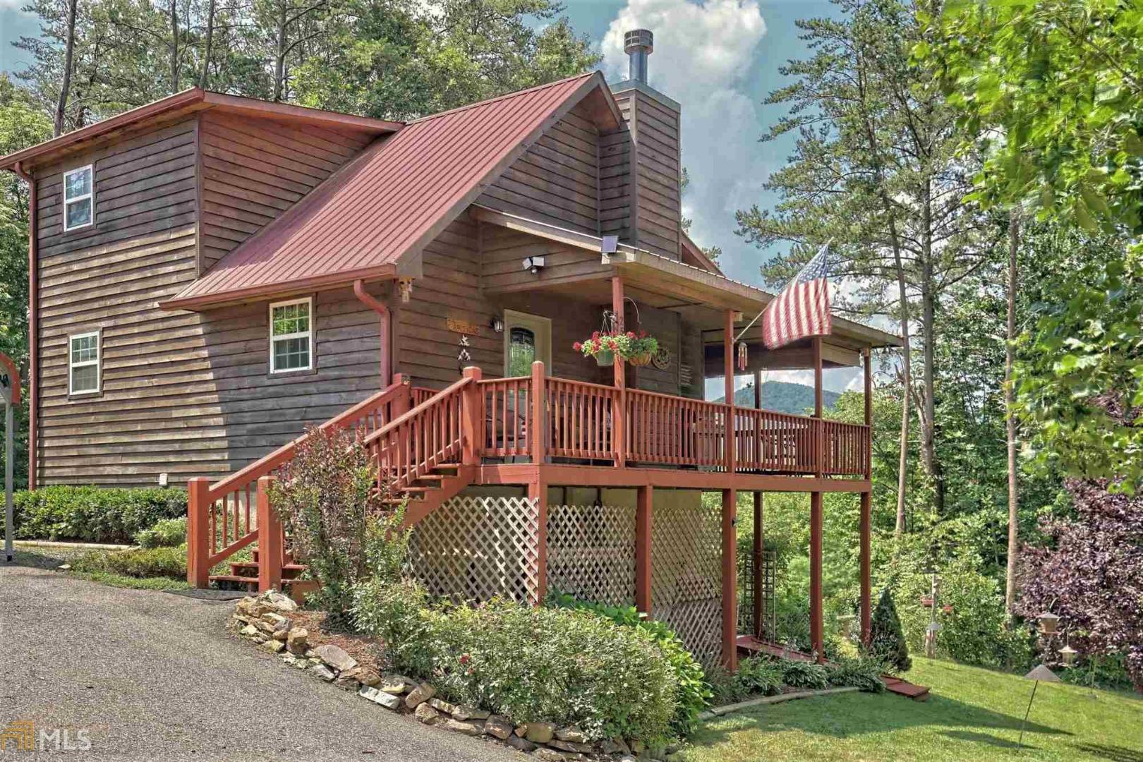 YOUR MOUNTAIN RETREAT IN TRACKROCK! Cool, calm, &, serene, your mountain home awaits your energetic family or friends! Year-round mountain views & lots to do. Beautifully remodeled. Careful detail to floors, walls & ceilings, new fixtures, custom kitchen cabinets, stainless appliances, Corian counters, new washer/dryer, totally remodeled baths with quartz vanities and beautiful barn doors in the master! House wired for generator; backup heat source; new retaining wall; new landscaping w. fruit trees & blueberry bushes! 1 garage in-house, 1 detached garage, & 2 car carport. A Radon Mitigation System for your family's piece of mind. The mountains are calling. Have fun riding horses, hiking, biking, gardening, or just relaxing on the view filled back porches!