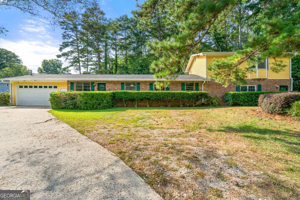Welcome to 1885 North Drive SW! This four-bedroom, two full bathroom, two half bathroom home has everything your family is looking for. Arriving at the home you will immediately notice our flat corner lot. This lot offers plenty of space for barbecue, throwing the football or whatever other activities you can think of. Our driveway and two car garage (with motor) offer ample parking. Enter through the front door and into the family room. The kitchen opens into the family room making it easy to entertain your guests. The kitchen includes beautiful stained wooden cabinets, tile backsplash, granite countertops and stainless steel appliances. Moving down our hallway we have three bedrooms, a full hall bath and a half bath in the first primary bedroom. On the far right side of the house we have our massive bonus room. This room is truly enormous and must be seen in person. The bonus room would be perfect for a large flat screen TV, sectional, pool table, wet bar or whatever else you can imagine. This room also has our washer/dryer hook up and our second half bath. Make your way up the stairs to our spacious primary suite. Again, you must see both spaces in person. The primary suite is the size of a studio apartment and includes a fireplace, walk in closet and full bathroom with walk in shower and separate tub. SELLER WILL PROVIDE A 1 YEAR HOME WARRANTY NOT TO EXCEED $1,000. -LEAVE SELLER INFO BLANK ON OFFERS (WE WILL COMPLETE THIS INFO OURSELVES) -LISTING AGENT IS ALSO OWNER -HOUSE DOES NOT MEET THE FHA 91 DAY FLIP RULE UNTIL NOVEMBER 25TH, 2025 -NO SELLER FINANCING OR SUBJECT TO OFFERS -PREFERRED CLOSING ATTORNEY SHERMAN AND PHALEN (ASK ABOUT DISCOUNTED TITLE FEES)
