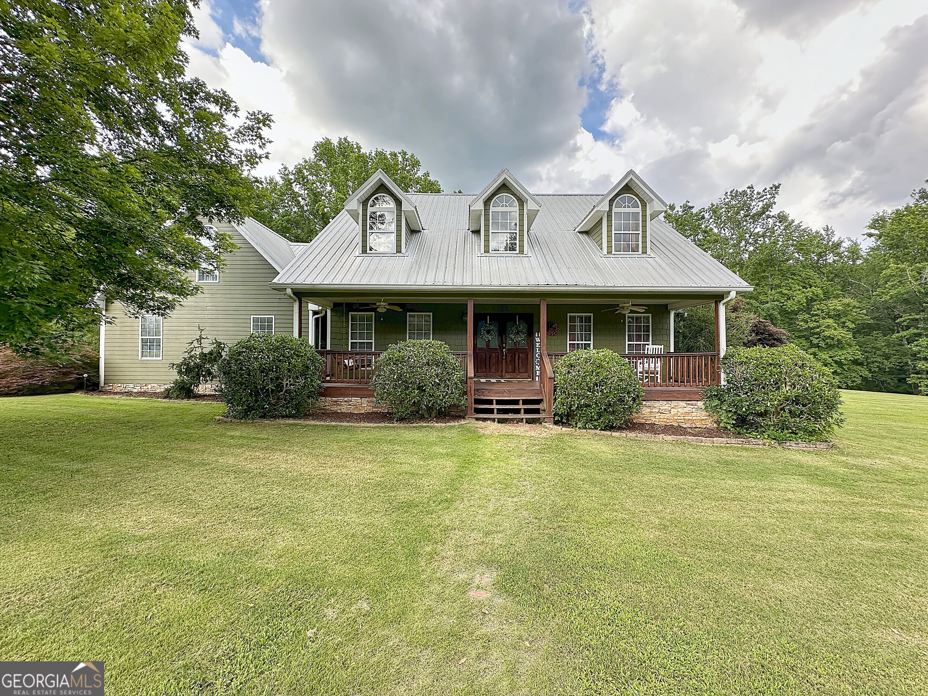 Beautiful home nestled on just under 11 stunning acres. This home has a little bit of everything... In-ground pool, rocking chair front porch, covered patio for entertaining, 32x26 metal building with power, 30x56 wired shop with lean-tos, abundance of fruit trees including plums, figs and muscadine vines, and meticulously landscaped. Inside features a welcoming foyer, large living room with vaulted ceilings and stone fireplace, separate dining room, open kitchen with a breakfast bar/island, lots of cabinet space, and breakfast area, master on main with a massive walk-in closet, soaking tub and tiled shower, two additional bedrooms on the main with a guest bath, bonus/4th bedroom upstairs, and so much more... Acreage, pool, 2 shops, this homes has a lot to offer.. Call today... listing agent is the brother of the seller.