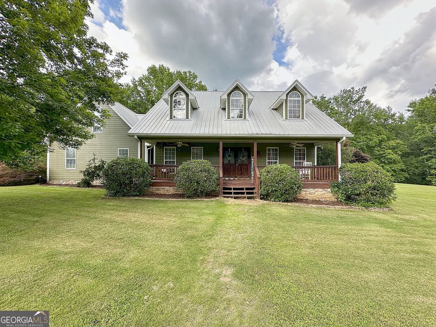Beautiful home nestled on just under 11 stunning acres.  This home has a little bit of everything...  In-ground pool, rocking chair front porch, covered patio for entertaining, 32x26 metal building with power, 30x56 wired shop with lean-tos, abundance of fruit trees including plums, figs and muscadine vines, and meticulously landscaped.  Inside features a welcoming foyer, large living room with vaulted ceilings and stone fireplace, separate dining room, open kitchen with a breakfast bar/island, lots of cabinet space, and breakfast area, master on main with a massive walk-in closet, soaking tub and tiled shower, two additional bedrooms on the main with a guest bath, bonus/4th bedroom upstairs, and so much more...   Acreage, pool, 2 shops, this homes has a lot to offer..  Call today...  listing agent is the brother of the seller.