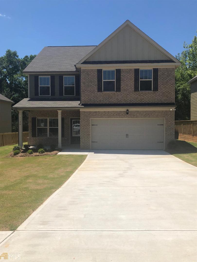 The Holly Plan featured at Locust Grove. This Community offers a picturesque downtown where you can enjoy local dining and shopping, with easy access to I-75. Make Grove Village your forever destination for your new home. Grove Village a Beautiful Gated Community featuring 4 to 5 bedroom plans. Grove Village features Craftsman Style brick front with 3 sides brick water table and true Hardi siding.The Holly offers an open concept with fully trim wood cased windows, open spindles, formal dining, conversational granite kitchen, 42" cabinets, breathtaking tile backslash, stainless steel appliance pkg, bronze light fixtures,private owner's retreat with sitting area and his/her closet with spa-like bath and more. Must see in order to believe the quality that is given in all of Capshaw Homes. Photos used for illustrative purposes and do not depict actual home....This Home is ready to close !! Up to $9k towards closing cost w/preferred lender Refrig and Blinds Additonal incentives for this home ..Ask Agent for Details.'
