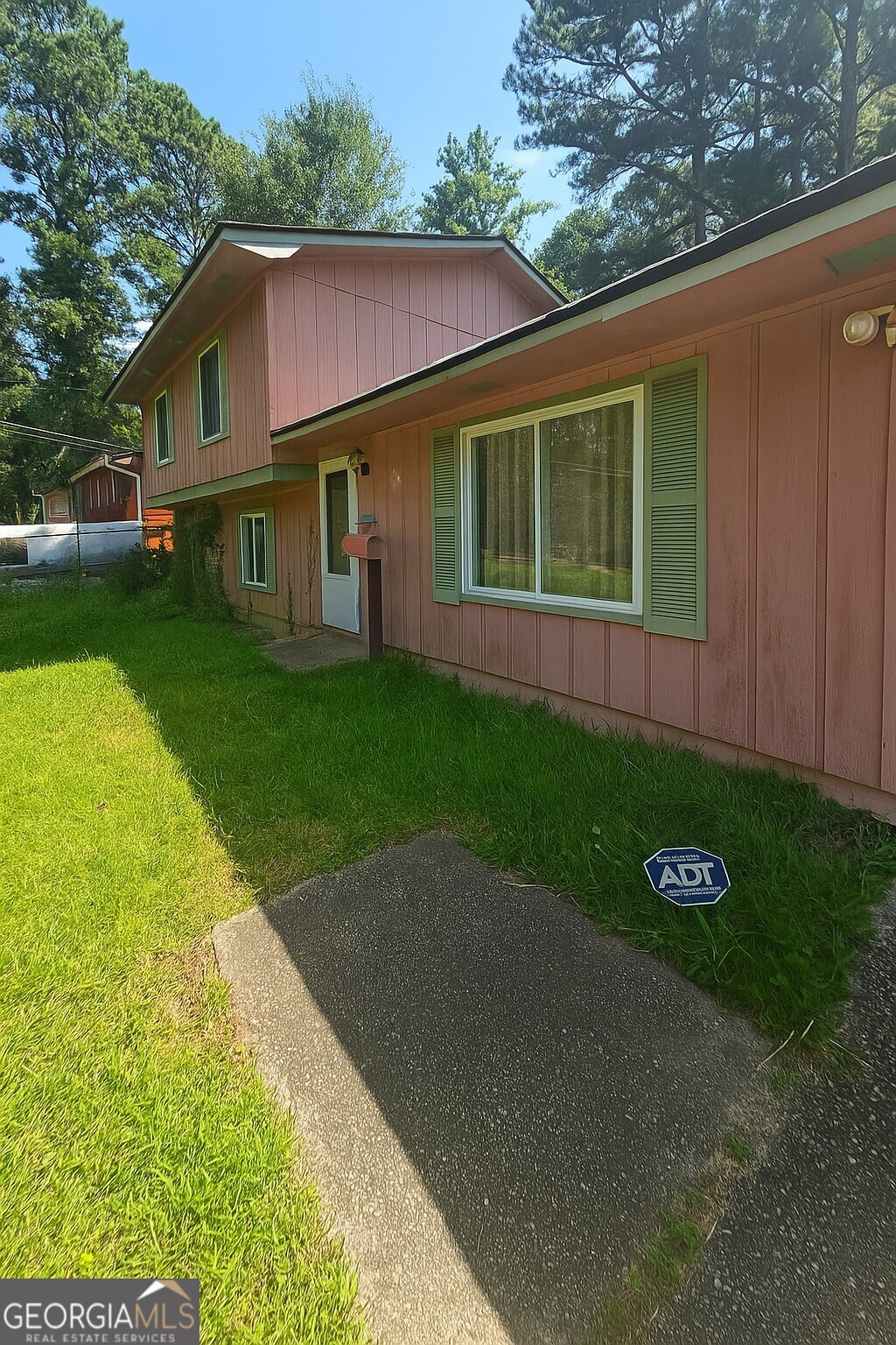 Don't miss this incredible opportunity to own a spacious split-level home just minutes from I-85, shopping, dining, and local parks. This well-designed property offers a formal living and dining room, plus an eat-in kitchen with classic wooden cabinets, ample storage, and generous counter space. Enjoy a cozy sunken family room filled with natural light and centered around a charming fireplace. Adjacent to the family room is a versatile bonus room with a closet-perfect for a home office, media room, or potential 4th bedroom. Upstairs, the primary suite features an updated walk-in shower and modern vanity. Two additional bedrooms and a full bathroom complete the upper level. Key updates include a newer roof and water heater, and the HVAC system appears to be in good working condition. With great bones and endless potential, this home is ready for your personal touch. Bring your designer and contractor to explore how this space can be transformed into your dream home. You'll love the layout, location, and everything the area has to offer. Schedule your showing today-this one won't last long!