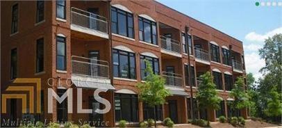 Two parcels at Flats of Puritan Mill apartment complex with a total of 24 units and a land lot. The location is just off the Loop 10 access and just a few miles from Five Points and the UGA campus. Call listing agent for details and financial packet. No showing until binding contract. Do not disturb tenants. Each apartment is a one bedroom, one bathroom upscale loft apartment with stainless appliances, granite countertops, private patios/balconies off the living room and off each bedroom, 10' ceilings and finished concrete floors. Each unit has it's own stackable washer and dryer, a very large bathroom with shower stall and a garden tub. There is an elevator for access to all three floors as well as common area stairs at each end of the building.