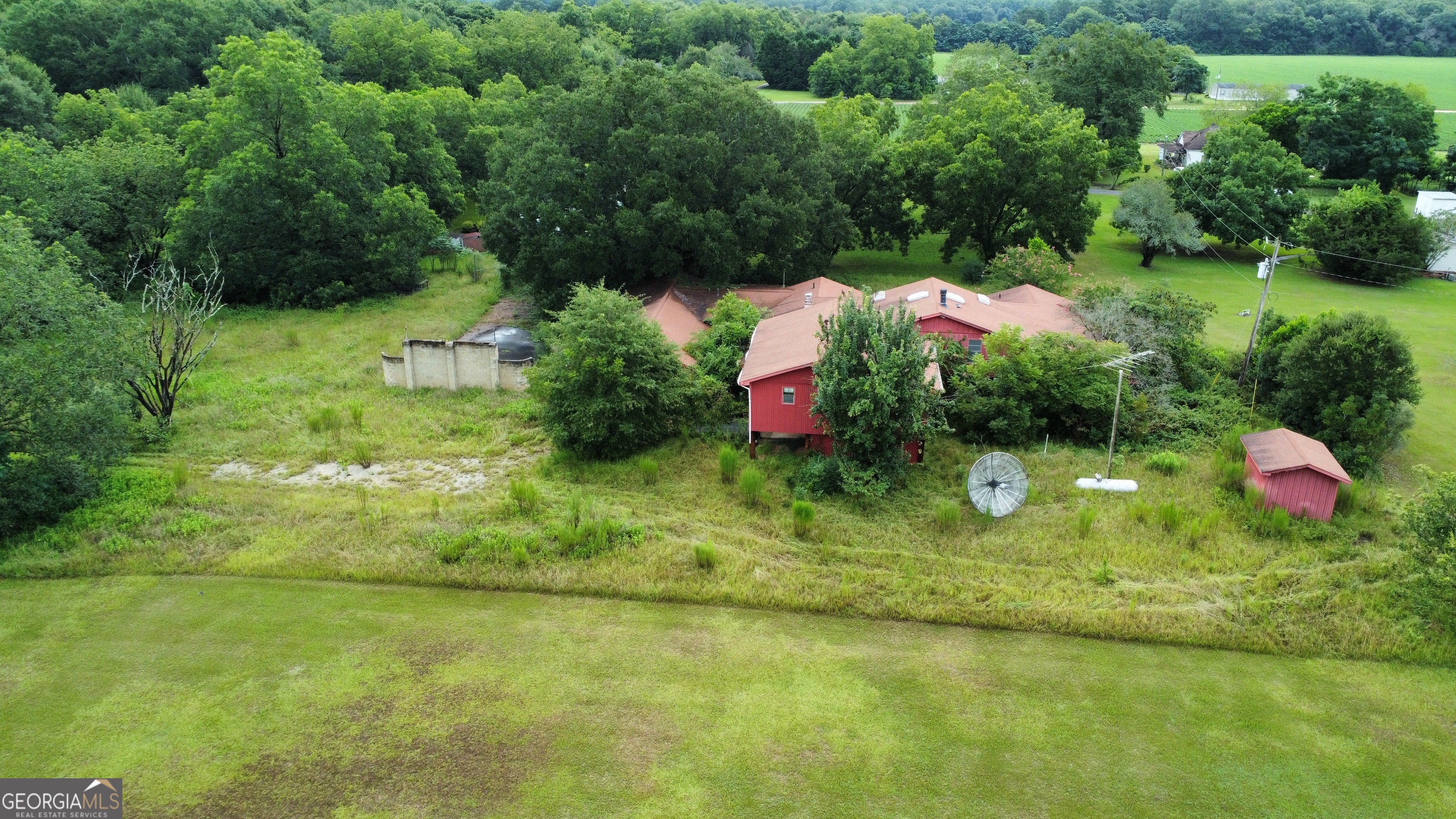 Rare opportunity in Perry, GA! This 10-bedroom, 5-bathroom home sits on 1.45 acres and is zoned R-3, offering endless possibilities for redevelopment, multi-family use, or renovation into a large private residence. The home needs repair but provides incredible potential with its size and location. An additional 3.45-acre lot is also available. Enjoy a peaceful countryside setting just minutes from I-75 and the Perry Fairgrounds. Contact the listing agent for details.