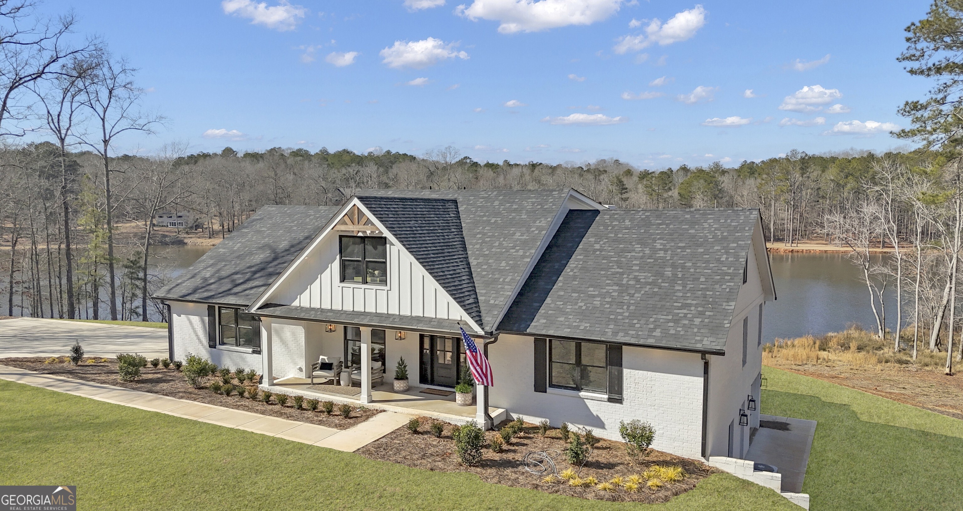 Beautifully Renovated Lakefront Rental - Private & Centrally Located Discover tranquility in this fully renovated custom home set on 7.74 private acres with stunning lake frontage and a private fishing dock. Ideally located just minutes from Trilith Studios, the new U.S. Soccer Headquarters, Peachtree City, and Downtown Fayetteville, this home offers over 3,000 sq ft of refined living space plus a full unfinished daylight basement for all your storage needs. The main-level primary suite features spa-inspired amenities, including dual vanities, a soaking tub, a fully tiled shower with dual showerheads, and custom his-and-hers closets. The gourmet kitchen boasts stainless steel appliances, a beverage bar, beverage fridge, and expansive cabinet space-all with serene lake views. Upstairs, you'll find three spacious bedrooms, two full baths, and two versatile bonus rooms ideal for work or guests. Enjoy peaceful mornings or private gatherings on the large covered back porch overlooking the lake and a beautifully cleared backyard that blends seamlessly into the landscape. Unfurnished and move-in ready. Your private retreat awaits.