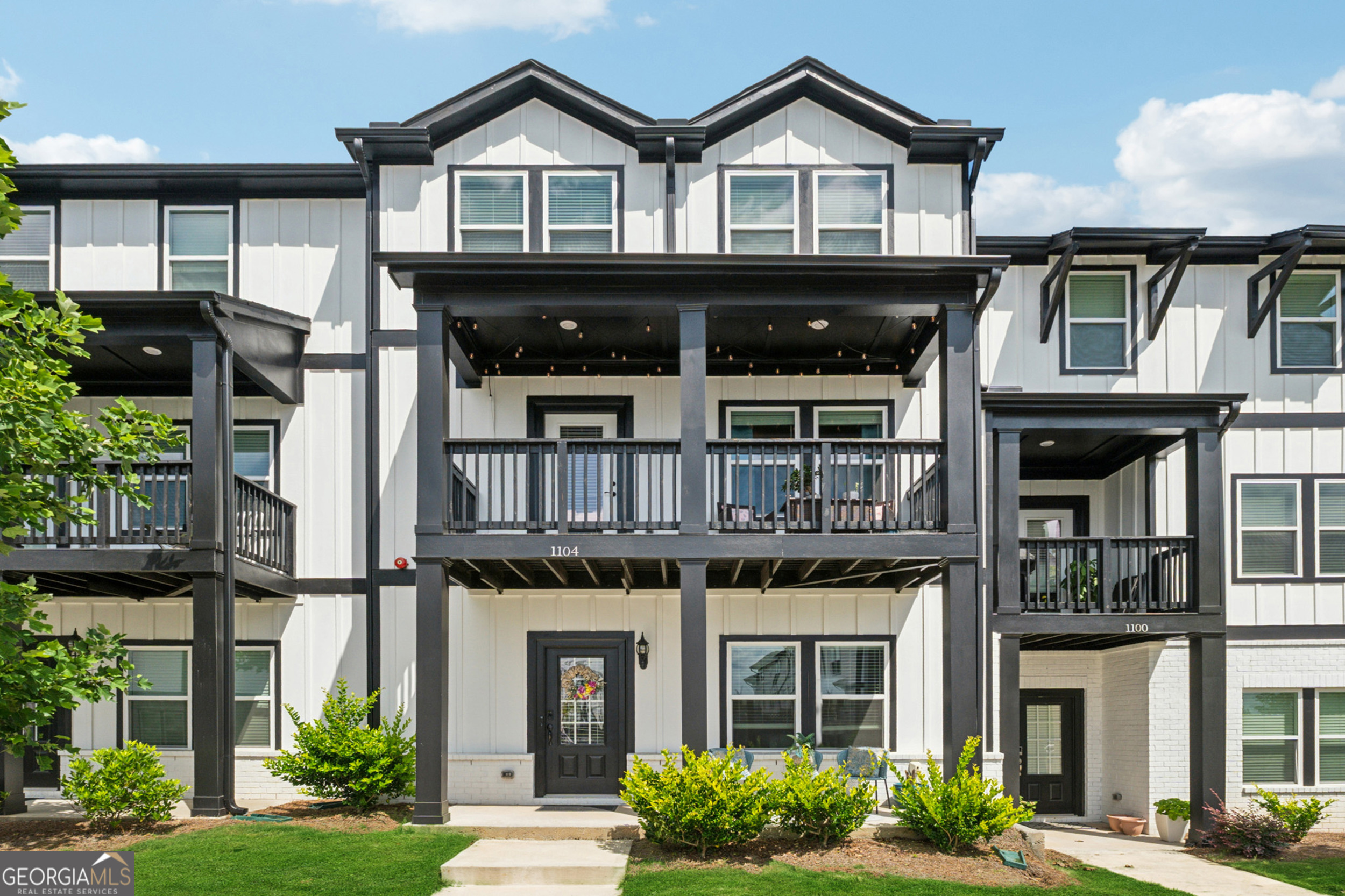 Step into sophisticated comfort in this beautifully designed townhome nestled in the Ridgewalk Landing community. With a layout that strikes the perfect balance between open flow and thoughtful separation, this home is ideal for both lively gatherings and peaceful day-to-day living. The gourmet kitchen is a showstopper-featuring a generous island, sleek gas cooktop, ample cabinetry, and top-of-the-line stainless steel appliances that make cooking a joy. Boasting 4 bedrooms and 3.5 baths, there's room for everyone to live and grow. A private bedroom with en-suite bath on the main level creates a perfect retreat for guests or extended family. Conveniently located near major highways, shopping at Costco, downtown Woodstock, and countless dining options - everything you need is right at your fingertips. Enjoy resort-style community perks like scenic walking trails, a sparkling pool, and incredible mountain vistas. Your next chapter starts here. Come explore this incredible opportunity!