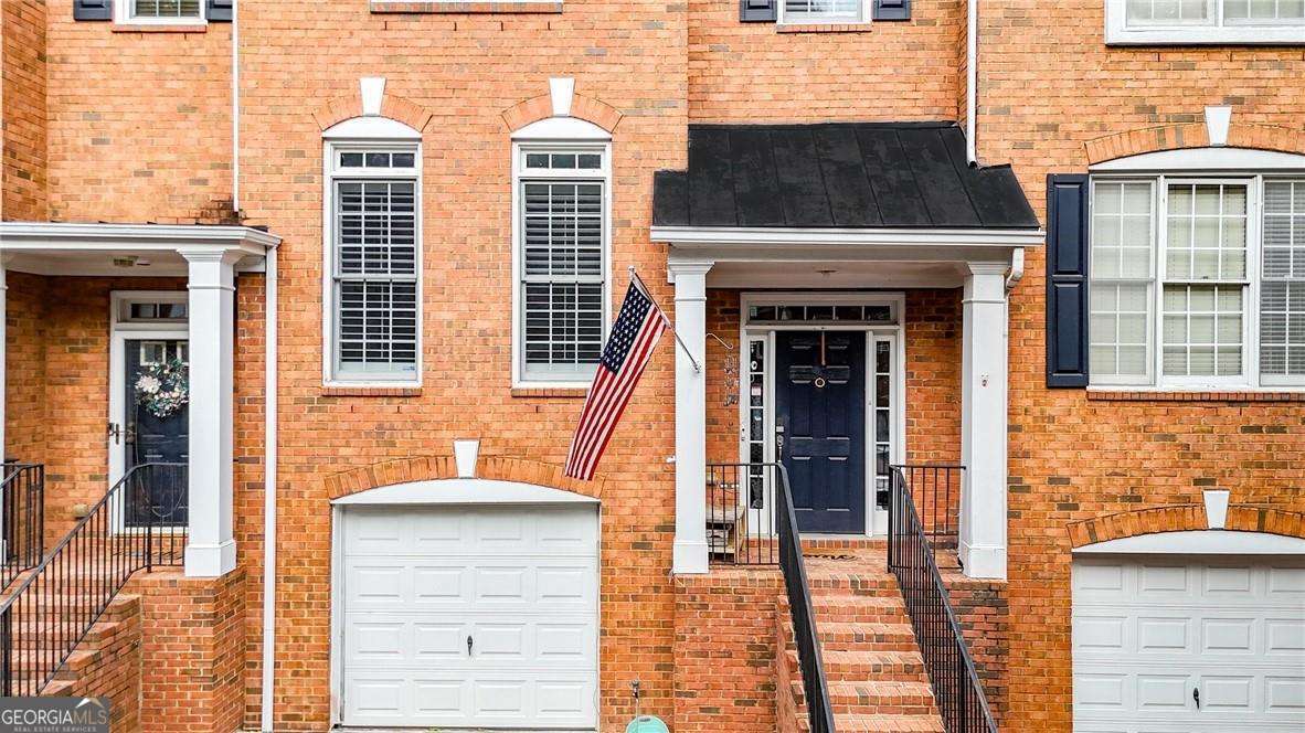 Welcome to this well-maintained 3-level townhome in a gated swim/tennis community in the highly sought-after Smyrna/Vinings area-offering Cobb County taxes with an Atlanta address! Enjoy a bright, open layout with LVP and hardwood floors throughout (including staircases). The quartz kitchen features a walk-in pantry and opens to a spacious family room with a cozy gas log fireplace. The finished basement includes a large bonus living area and a back room stubbed for a full bathroom (shower, toilet, and sink)-plumbing is in place, just add drywall to complete. Ideal for a guest suite, home gym, or office. Step outside to a partially covered, gated deck overlooking peaceful green space-and best of all, the property backs up to the Silver Comet Trail/Beltline connector, offering direct access to outdoor recreation right from your backyard. This move-in ready home comes with a 1-year home warranty and is located in a beautifully landscaped, amenity-rich community-perfect for anyone seeking comfort, convenience, and value in a prime location.