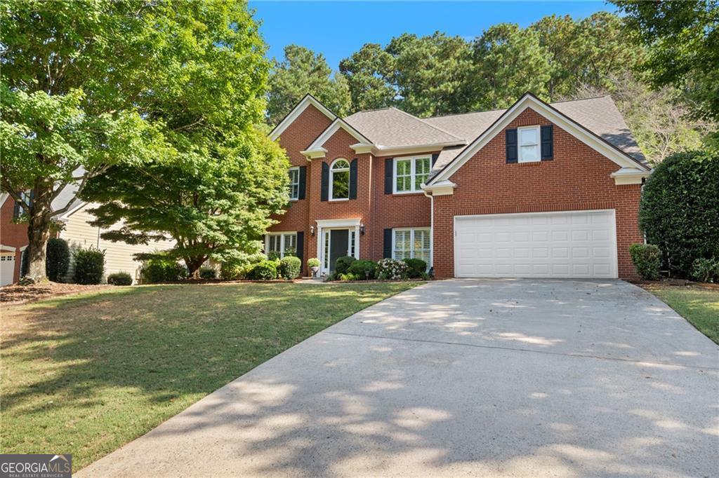 Coming Soon - Alpharetta Address, Forsyth County Taxes! Welcome to 460 White Rose Trace, a stunning brick-front home in the highly desirable Wind Rose subdivision. This beautifully maintained residence offers the perfect blend of modern updates, open living spaces, and a prime location. Step inside to find an inviting open family room with a cozy fireplace, flowing seamlessly into a fully updated kitchen featuring a stylish backsplash, large island, quartz countertops, and plenty of room to gather. Enjoy a formal sitting room, open dining area, and a dedicated office-perfect for today's lifestyle. Upstairs, you'll find 4 spacious bedrooms, including a serene primary suite with a remodeled bathroom and a custom closet designed for organization. Hardwood floors throughout the lower level add warmth and elegance, while recent updates such as a new roof and new hot water heater provide peace of mind. Relax outdoors on the patio deck in the quiet private backyard, ideal for entertaining. Located in a vibrant Swim/Tennis community, this home is just minutes from Halcyon, shopping, dining, and top Forsyth schools-all with the benefit of low Forsyth County taxes and a sought-after Alpharetta address.