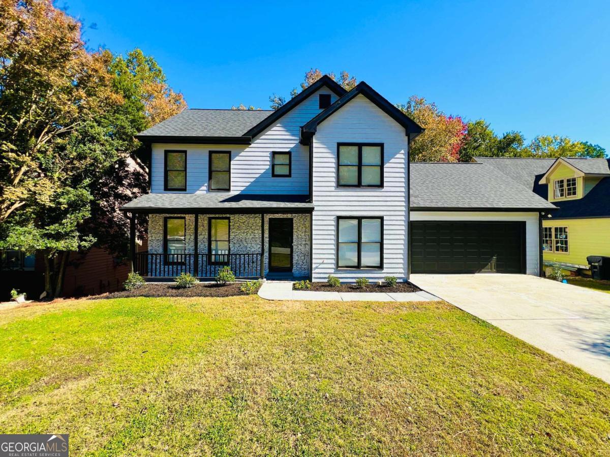 Welcome to this stunning executive-style 5 bed 3.5 bath home in the desirable Camden Square community, just minutes from Sugarloaf Parkway and Highway 316, offering convenient access to shopping, parks, and restaurants. This residence features an inviting front porch, perfect for morning coffee, along with a deck on main-level and a spacious backyard deck, ideal for entertaining. Inside, you'll find formal living and dining areas that seamlessly flow into a bright eat-in kitchen with ample cabinetry and generous counter space. The cozy family room boasts a beautiful fireplace, creating a warm and inviting atmosphere, while brand new LVP flooring runs throughout the main level, upstairs, and in the basement. The bedrooms feature brand new carpet, ensuring comfort and style. Retreat to the luxurious master bedroom upstairs, complete with a modern en-suite bath featuring a separate shower and a relaxing tub, along with a spacious walk-in closet within the bedroom. The versatile finished basement includes a large bedroom with a walk-in closet and a bonus room that can serve as an office, exercise space, or recreation area. Don't miss this incredible opportunity-experience luxury, comfort, and convenience in this exceptional home! Corporate member holds GA Real Estate License