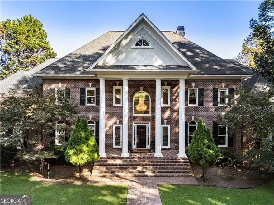 Welcome to Tullamore - one of Milton's most prestigious estate communities, perfectly situated in the heart of this charming Georgia town. Nestled on nearly seven private acres, 15385 Tullgean Drive is a meticulously maintained Southern estate that embodies timeless elegance and exceptional craftsmanship. The property features a serene pond, lush gardens, and direct access to the community's private horse and walking trails. A gated private drive leads to the stately four-sided brick residence, showcasing architectural refinement at every turn. Inside, the main level welcomes you with a two-story grand staircase, formal living and dining rooms, a fireside great room, and a beautiful screened porch/sunroom overlooking the grounds. The chef's kitchen offers an inviting island, a sunny breakfast room, and convenient access to the 3.5 car garage. The main-level primary suite is a luxurious retreat, complete with dual walk-in closets, a spa-inspired bath, and an adjacent private office-perfect for working or relaxing in comfort. Upstairs, discover five spacious bedrooms, each with ample closet space and private en-suite baths, offering privacy and comfort for family and guests alike. The terrace level is designed for entertainment and versatility, featuring a wet bar and recreation room, media room, gym, craft room, and a 1,500-bottle wine cellar. Two fully appointed in-law suites provide flexibility, one with a full kitchen and the other with a kitchenette-ideal for multi-generational living or extended stays. Outside, the level back yard showcases views of the in-ground pool and pond beyond, framed by trees and open green space. Enjoy the chicken coop, community tennis and pickleball courts, and the tranquil Tullamore trail loop connecting the neighborhood's estates. Conveniently located near Birmingham Crossroads, residents have easy access to restaurants, shops, a grocery store, fitness center, and essential services. Local favorites such as Seven Acre Bar and Grill, Scottsdale Farms, Downtown Crabapple, Alpharetta, Avalon, and Halcyon are all just minutes away. With top-rated Georgia schools and a peaceful rural setting surrounded by modern conveniences, this extraordinary estate offers the very best of Milton living-refined, private, and effortlessly connected.