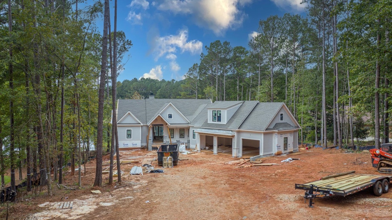 "YOUR PRIVATE LAKE FRONT RETREAT, UNDER CONSTRUCTION CUSTOM HOME LOCATED IN THE SOUGHT AFTER NEIGHBORHOOD OF PARROTTS POINTE OF REYNOLDS" Why wait for 2 years to build when you can enjoy this BRAND NEW construction luxury home sooner by Luxe Construction, builder of quality homes at Reynolds Lake Oconee. This home offers over 5,600 sq ft, 6 bedrooms,6 baths, 2 half baths, transitional style with open floorplan, lots of natural light, shiplap. There are two suites on the main level including the gorgeous master suite, a spacious two-bedroom suite above the three car garage. Luxury chef's kitchen with quartz countertops, custom cabinetry, Wolf appliances. Screened porch with fireplace overlooking the fantastic lake view and pool and sprawling level backyard. Ideally located minutes to the Ritz, Lake Club and Richland Pointe by boat, this home sits on a .97 acre prime lakefront property and is a MUST see.