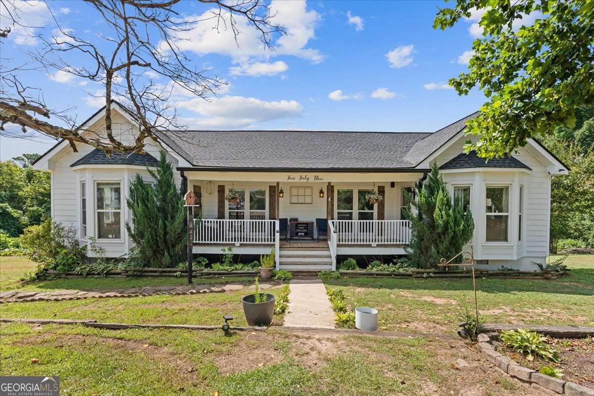 This lovely custom-built home on over half an acre of land in beautiful Buchanan is filled with all of the southern charm you're after including large, covered front and back porches for relaxing in your rocking chair. A big living room with plenty of natural light and a cozy fireplace flows into the eat-in kitchen with pantry. The home's primary bedroom is oversized and features and en suite bath with double vanity. Three additional bedrooms are all well-sized and share a hall bath. There's a large separate laundry room, too. Don't miss out on this one! It will go quickly.