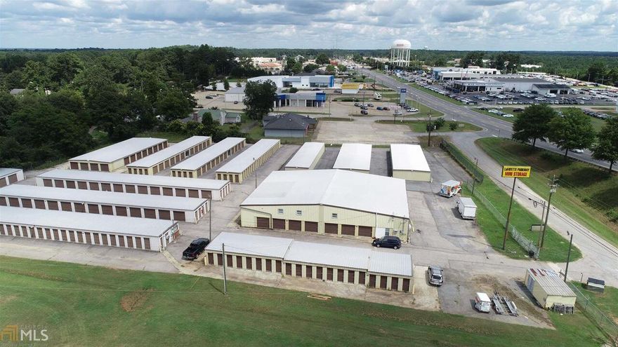 Location.Location. The sky is the limit. Lots of opportunity for this property. Approx 400 storage units. Main office building has an apartment. Roof only a few years old on storage units. New security gate with 24 hour access security and cameras. Adjoining land and buildings can be purchased as a package deal.