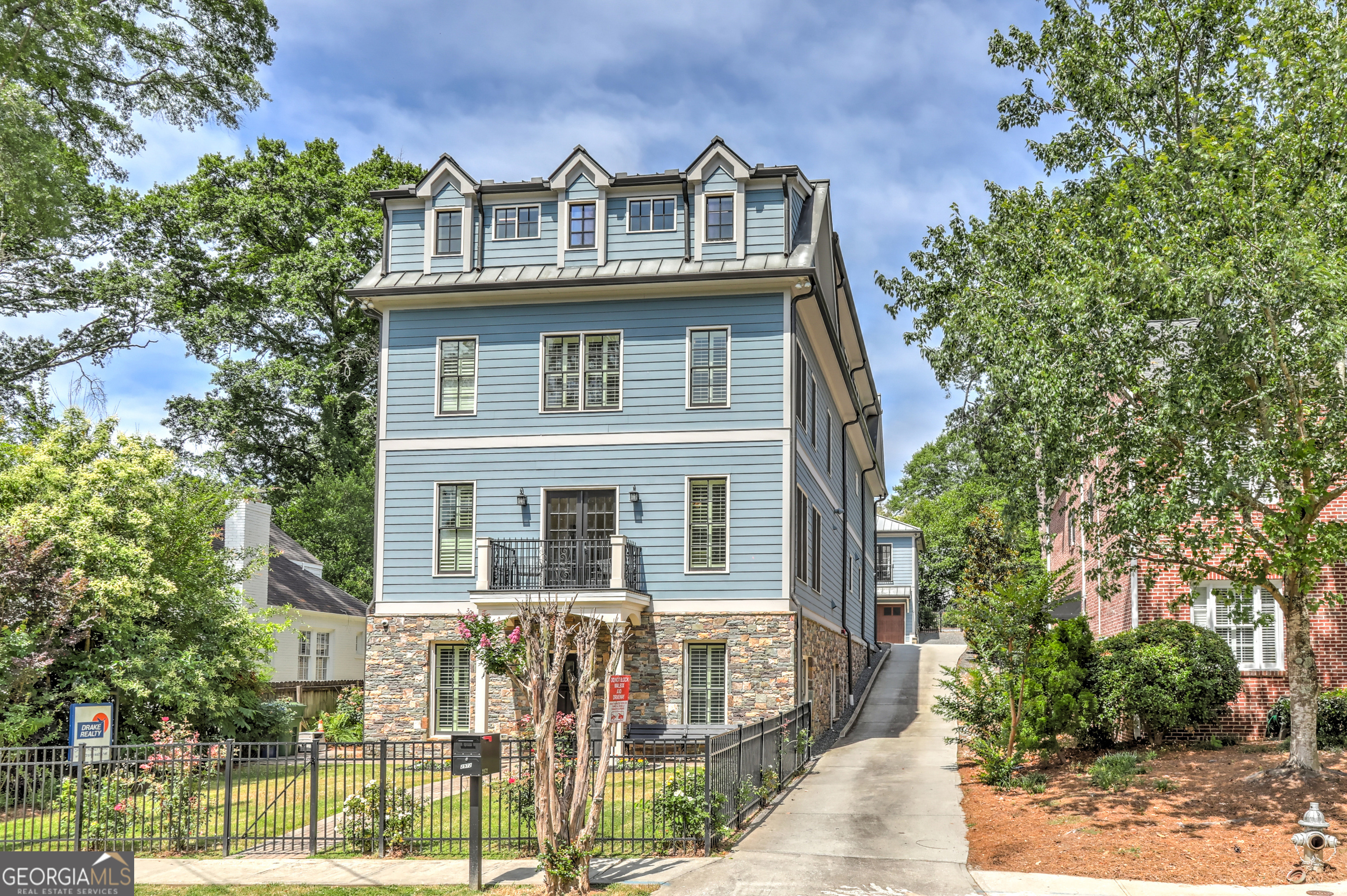 INCOME, INCOME, INCOME-Live/Work/Rent in the heart of Buckhead in a custom built 8-bedroom 9500 sq. ft. home with an additional 2400 sq. ft of storage, and a 3-car garage. Unique property zoned residential/commercial. Use the entire space yourself or utilize the opportunity for either full or partial lucrative income producing aspects the property offers. Detached and separate entrances in every access point of this property. Located in Garden Hills walkable to all area restaurants, the Streets of Buckhead, parks, and area businesses. Close to both I-75, I-85, and GA 400 with easy ways to quickly access your destination. Use your entrepreneurial imagination on the best use and utilization of this property. Perfect for in town living, multigenerational living, a Bed and Breakfast, Chef inspired meals with Wine Tastings, Wedding Venue, with an office area on the bottom floor to privately meet clients. The office is the Ultimate Professional Space** - Four beautifully appointed individual offices, two with full baths - A reception area for your clients, including a handicapped-accessible bath - A break room - A conference room - A separate entrance featuring its own gourmet kitchen, two full baths, and exclusive meeting space. Take the elevator from your office to the additional levels of the home which you can arrange with your vision in mind. The elevator will take you to the 2nd floor which opens to A chef's and caterer's kitchen equipped with premium Wolf/Subzero appliances, four sinks, two dishwashers, and a butler's pantry -Nest Utilities tankless water heaters, AC units with ERV ventilation, Spray in insulation for energy control and efficiency - A 600 Bottle wine room that is temperature-controlled for the connoisseur - Four bedrooms, each with a private en suite bathroom and walk-in closets - Steam room/shower in master shower - A spacious and elegant dining area, perfect for casual or lavish entertaining. The two-story carriage house can be accessed via the elevator, or by simply walking to the separate entrance. The carriage house has a spacious open area on the bottom floor for multi-purpose use. The 2nd level of the Carriage House has 2 bedrooms with en suite bathrooms, an open floor plan, and a chef's kitchen. Perfect structure for a long-term rental, to house extended family members, VRBO, or utilize to entertain guest or business associates. A Rare Buckhead find offering an opportunity to own a property with both commercial and residential zoning. This versatile property not only promises high rental yields but also provides the flexibility to adapt the property to your vision. The property is within walking distance of the Atlanta International School, and close to many of the area's top public and private schools. The home is priced below the appraised value. Private: