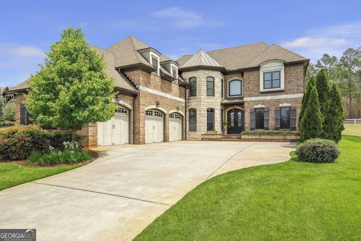 For Lease in Traditions of Braselton! Welcome to this incredibly beautiful home located in one of Georgia's hottest markets-Traditions of Braselton Golf Community! This stunning two-story home offers luxury, comfort, and convenience all in one of the most sought-after neighborhoods. Step inside to find a gourmet kitchen with custom cabinetry, stainless steel appliances, and a large island that opens to the cozy keeping room-complete with its own fireplace. Just steps away, the spacious living room offers a second fireplace and serene views of the backyard. The main level also includes a formal dining room, a private study/office, a secondary bedroom/in-law suite, and a convenient powder room for guests. Upstairs, you'll find a luxurious primary suite with a separate sitting room and wet bar, perfect for unwinding at the end of the day. The ensuite bathroom features a jacuzzi tub, walk-in closets, and a separate shower with body jets. One of the secondary bedrooms upstairs has its own private ensuite bath, while the other two share a spacious Jack-and-Jill bathroom. A three-car garage completes this incredible home, making it a rare rental opportunity in today's market. Enjoy resort-style living with Traditions of Braselton's incredible amenities, including a championship golf course, resort-style pool and splash pad, tennis and pickleball courts, fitness center, miles of walking trails, on-site restaurant, and year-round community events. More photos will be posted within the next week-stay tuned! Don't miss your chance to lease this one-of-a-kind home in one of Georgia's premier communities!