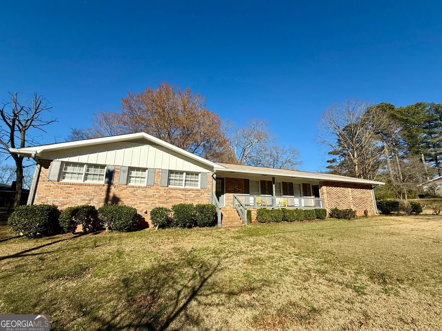 This beautifully renovated all-brick ranch at 1010 Wesley Park Drive in Marietta, GA, features a modern open floor plan with a brand-new kitchen and bathrooms. The home includes a new two-car garage and mature landscaping. It is situated in a safe neighborhood with excellent schools. Additional amenities include a large outdoor storage space, a washer and dryer, new flooring, cabinets, countertops, a new HVAC, and stainless steel appliances.