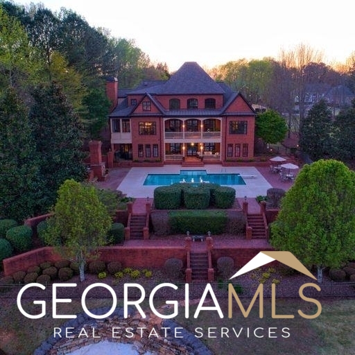 This custom-built European lakefront home is located in Oak Mountain Golf Course. The home sits on the 9th tee box and has lakefront views with a private beach area. The 6 bedrooms and 6.5 bathrooms are flowing generously through the 7,254 heated square feet floorplan. Custom all brick house with imported hand crafted windows and Brazilian cherry hardwood floors through. Custom tile in all baths and laundry room. Spacious open layout throughout is perfect for entertaining. Triple French doors in the keeping rooms on bottom and main level open to covered porches that overlook the pool/spa/outdoor fireplace. Gourmet kitchen with quartz countertops, marble backsplash, full-sized island, all commercial kitchen appliances and wet bar. Buyer does have an option to purchase additional lot adjacent to home. Inquire for more details