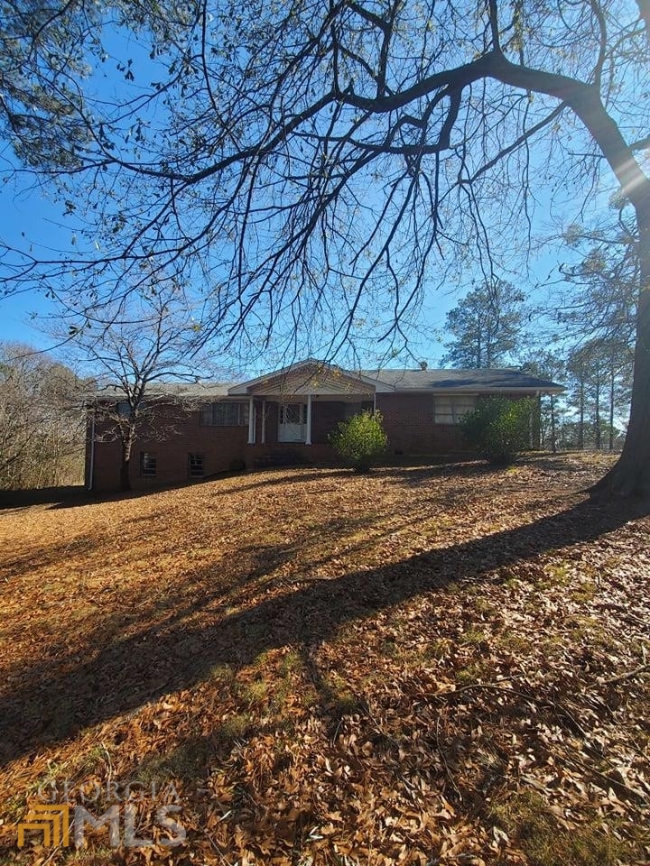 This All Brick "Potential Commercial" Home Sits on 2.5 Prime Acres and boasts a sprawling floor plan of 4 Large bedrooms / 3 full baths, An Open Kitchen, Formal living room and Den. Tons of storage and expansive closet space. A full basement with a Kitchenette area, Full bath and a new garage door for Boat storage entrance. The Large detached garage offers 2 bay doors and a shed, with a smaller attached building with its own entrance off the side. HVAC, Water heaters and laundry area are all located in the basement. All interior doors are solid wood. Transferrable Termite Service. Water heaters (2 - Kitchen has a dedicated unit) are less than 1 year old. Septic was serviced back in 2019. Home Qualifies for Commercial - Contact Donald Wells @ 770-528-2091 for further info. He is with Cobb County Zoning.