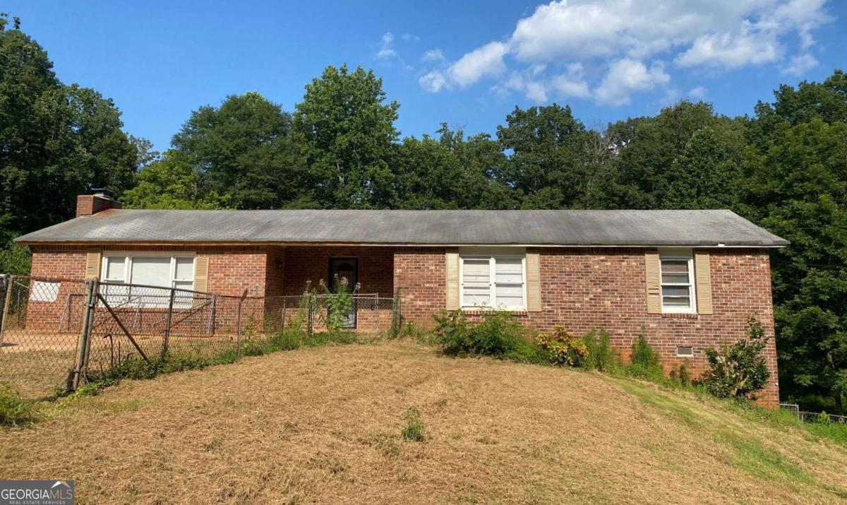 Great house to fix up. Includes the vacant lot to the right which is 7001 Richard Lane (Lot 11). Large kitchen with new dishwasher and refrigerator. Awesome great room with brick fireplace and sliding glass door to the oversized patio. Newer master bathroom with double vanity and walk-in closet. Extra large backyard, cul-de-sac lot.