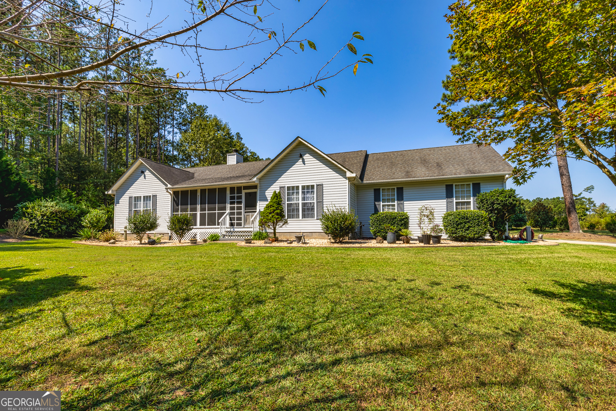 YOU DO NOT WANT TO MISS OUT ON THIS WONDERFUL PROPEERTY!! ONE LEVEL, WELL MAINTAINED 3 BEDROOM, 2 BATH HOME ON 4.01 PRIVATE ACRES! THERE IS A STAND OF TREES IN FRONT OF THE HOME AND APPROXIMATELY 2 ACRES OF TREES IN THE VERY BACK OF THE PROPERTY. PROPERTY IS GATED FOR PRIVACY AND TO KEEP YOUR PETS FROM ROAMING. IN ADDITION TO THE THE WORKSHOP SET UP ON THE OVERSIZED GARAGED , THERE IS A SEPARATE WORKSHOP, WELL HOUSE, AND RV PARKING PAD WITH ELECTRICITY, WATER AND A SEPARATE SEPTIC SYSTEM. CARE HAS BEEN GIVEN TO MAINTAIN HOME IN GREAT CONDITION. EXAMPLES ARE THE CRAWL SPACE HAS PLASTIC AND 6 LIGHTS AND A DEHUMIDIFIER THAT STAY ON 24/7. NO DAMPNESS OR MOISTURE. THE WELL PUMP HAS A SYSTEM TO NOTIFY YOU IF PUMP IS HAVING A PROBLEM. PLENTY OF OUTSIDE LIGHTING FOR SEEING IN THE DARK. THE WATER SOURCE TO THE HOME IS PUBLIC WATER, BUT THERE IS A FUNCTIONING WELL ON THE PROPERTY THAT THE CURRENT OWNERS USE FOR THE RV PAD AND MAINTAINING THE LANDSCAING. THE INSIDE OF THE HOME HAS BEEN TAKEN CARE OF AS WELL. THERE IS A NEW LIFETIME LAMINATE IN THE KITCHEN AND CARPET THROUGH OUT. ROOMS INCLUDE AN EAT IN KITCHEN, LARGE LIVING ROOM, MASTER BED AND BATH AND TWO ADDITIONAL BEROOMS WITH A BATH. THE SCREENED FRONT PORCH AND THE STAINED BACK DECK ARE WONDERFUL FEATURES TO ENJOY YOUR PRIVATE YARD. CALL YOUR AGENT FOR A SHOWING OR CONTACT THE LISTING AGENT.