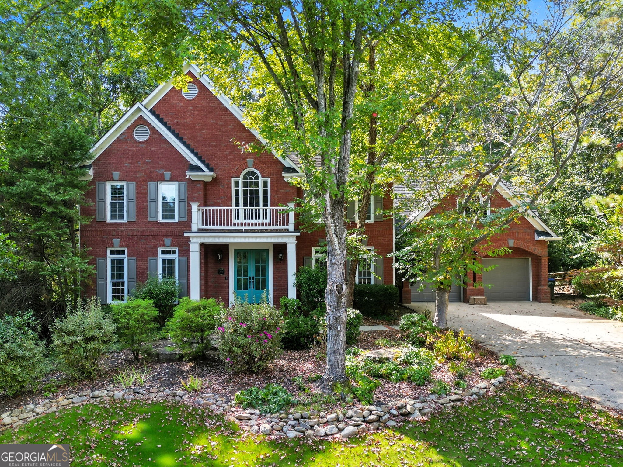 PRIME ROSWELL LOCATION - Just across from the Roswell Riverwalk and the Chattahoochee River. Nestled at the end of a quiet cul-de-sac in the highly sought-after newest section of Inverness Subdivision, this stately home boasts outstanding curb appeal that sets the tone for what awaits inside. Step into the dramatic two-story foyer, flanked by a formal living room (or office) and a spacious formal dining room. The sun-filled family room features a wonderful wall of windows overlooking the private backyard and flows seamlessly into the bright, open kitchen with stainless steel appliances, a large breakfast bar, and an eat-in area. Upstairs, a loft-style landing overlooks the main living area. The oversized primary suite includes a sitting room and a luxurious en-suite bath with vaulted ceilings, jetted tub, separate shower, and dual vanities. The upper level also offers a guest suite with private bath plus two additional bedrooms connected by a Jack-and-Jill bath. The finished terrace level is a standout feature, offering a full kitchen, generous living space, private bedroom, and full bath-perfect for multi-generational living, an au pair, or hosting long-term guests. Outside, enjoy the gated patio, private wooded views, landscaped gardens, and a level side yard-ideal for entertaining or quiet relaxation. This home is a must-see!