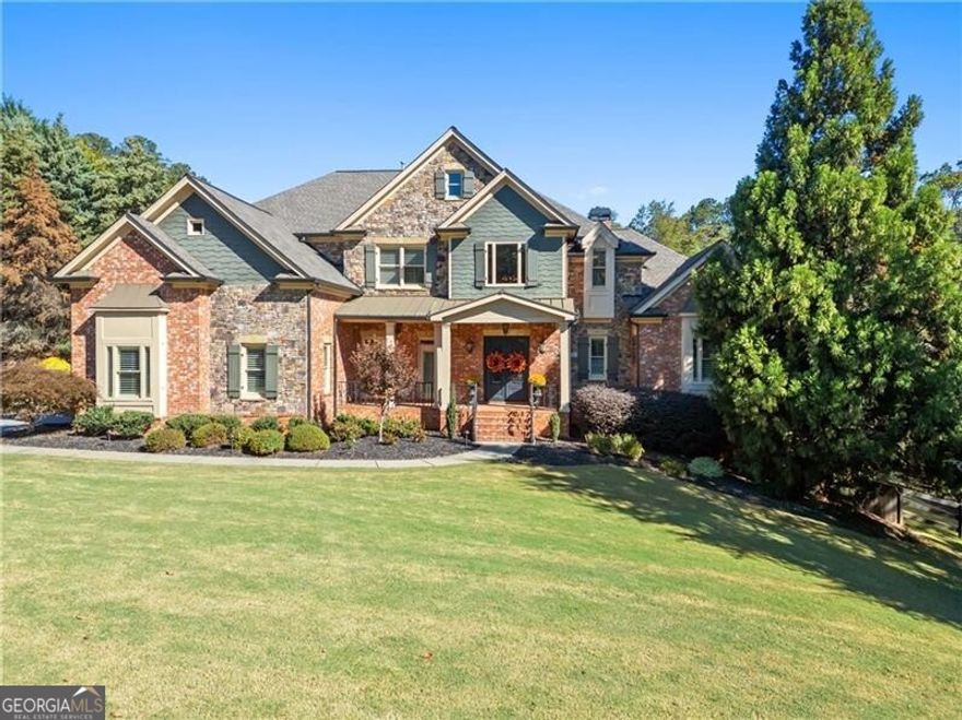 Just a short drive to Lake Lanier, get ready to discover refined living in this gated South Forsyth luxury estate community, ideally located near award-winning schools, shopping, hospitals, and Hwy 400. This stunning custom home offers over 7,600 sq. ft., this 5-bedroom, 5.5-bath all-brick home exudes elegance and comfort. The main level features a designer primary suite, chef's kitchen, and cathedral-ceiling cozy keeping room. Enjoy year-round outdoor living with a heated saltwater pool, waterfalls, fire bowls, hot tub, and cedar gazebo with fireplace and TV. The terrace level offers endless entertainment value with a full bar, wine cellar with tasting room, home gym, media theater, and guest suite. Enhanced by professional landscaping, new exterior lighting, and a 3-car garage, this exceptional estate combines privacy, sophistication, and convenience just minutes from Lake Lanier.