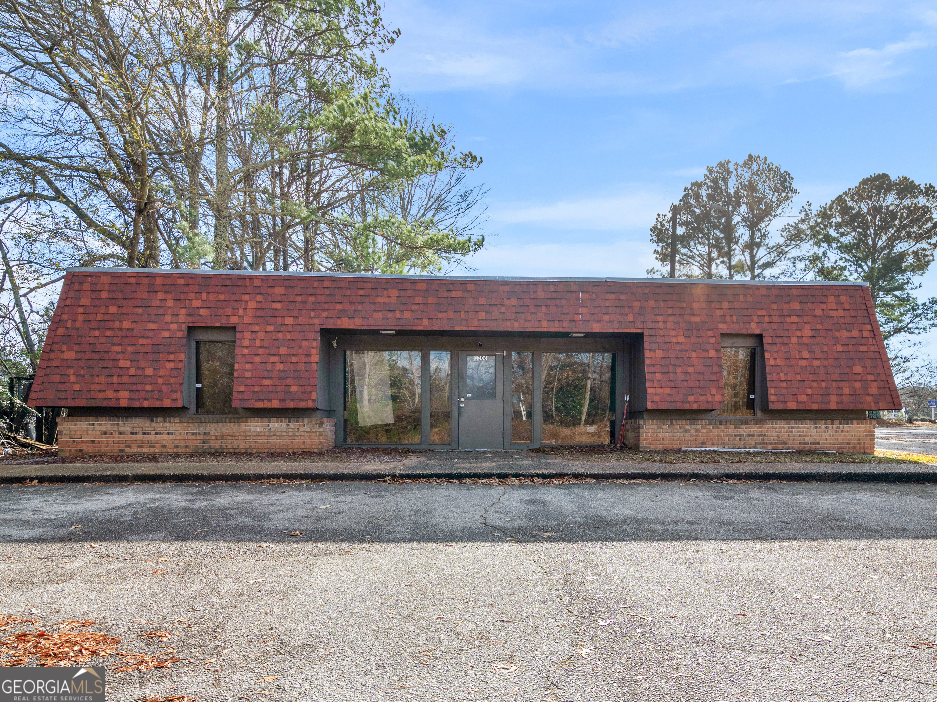 Schedule your showing of this 1740 square foot office building with two restrooms and a full kitchen. The adjacent building located at 1308 W Solomon Street, which is 2442 square feet, is also available.