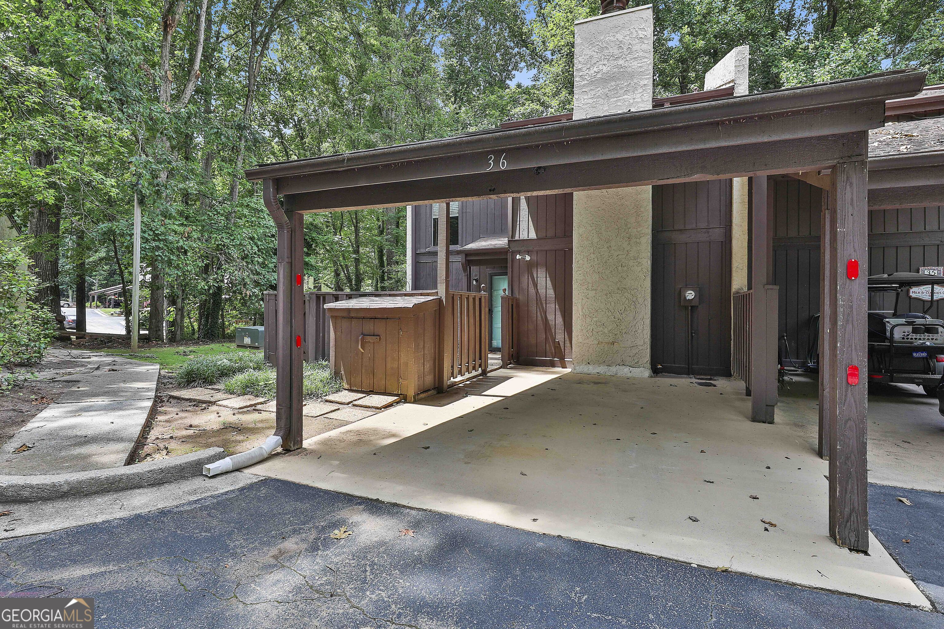 Renovated 3 bedroom 2.5 bath end unit townhouse is in n ideal location in Peachtree City. This unit has new LVP flooring on first floor, new carpet on stairs and second level and new paint throughout. Cabinets have fresh paint. Fully equipted kitchen with new stainless steel refrigerator with w/d closet. Lovely great room with mirrored wall in dining room that looks out to rear patio with private view. Additional office/rec room/flex room on main. Three bedrooms upstairs with two full baths and a balcony off the main bedroom. Front inviting fenced courtyard at entrance to condo with covered carport and additional off street public parking. Move in ready. Enjoy the pool and playground, walking trails, golf cart paths, golf courses, shopping and award-winning schools. Welcome home.