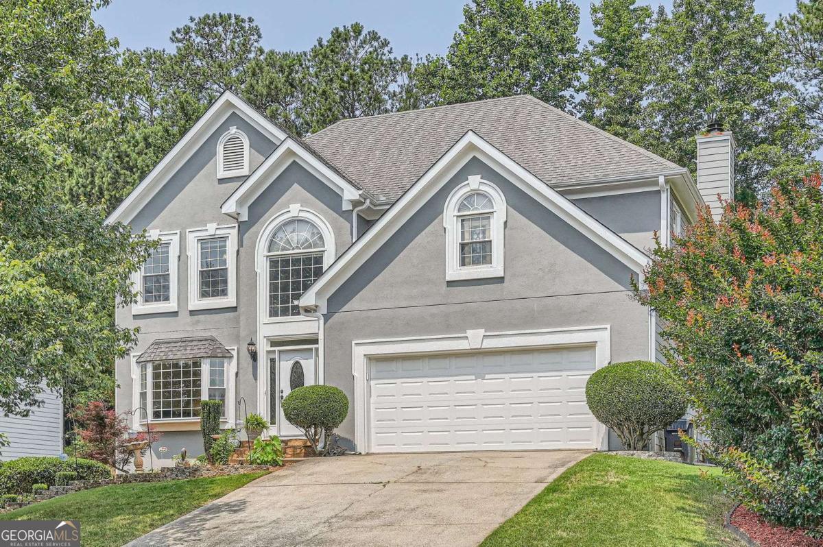 Stunning 5BR/3.5BA Home in Highly Sought-After Johns Creek Located in a top-rated school district and a desirable neighborhood, this spacious home offers the perfect blend of comfort, functionality, and style. Beautiful hardwood floors flow throughout the main level, which includes separate formal living and dining rooms-ideal for entertaining. The bright, eat-in kitchen opens to a cozy family room with a fireplace, creating a warm and inviting gathering space. Step out onto the expansive screened-in porch and deck, perfect for relaxing or entertaining, all while enjoying views of the private, wooded backyard. Upstairs, the oversized master suite boasts elegant tray ceilings and a charming sitting area. The en-suite bathroom features a tub, separate shower, and double vanity. Three additional generously sized bedrooms and a full bath complete the upper level. The finished terrace level offers exceptional versatility with a separate entrance. You'll find a recreation room, second kitchen, bedroom and bath-perfect for an in-law or teen suite. You'll also find a dedicated office and exercise room on this level. Don't miss this opportunity to own a beautiful, well-maintained home in one of Johns Creek's most coveted locations!