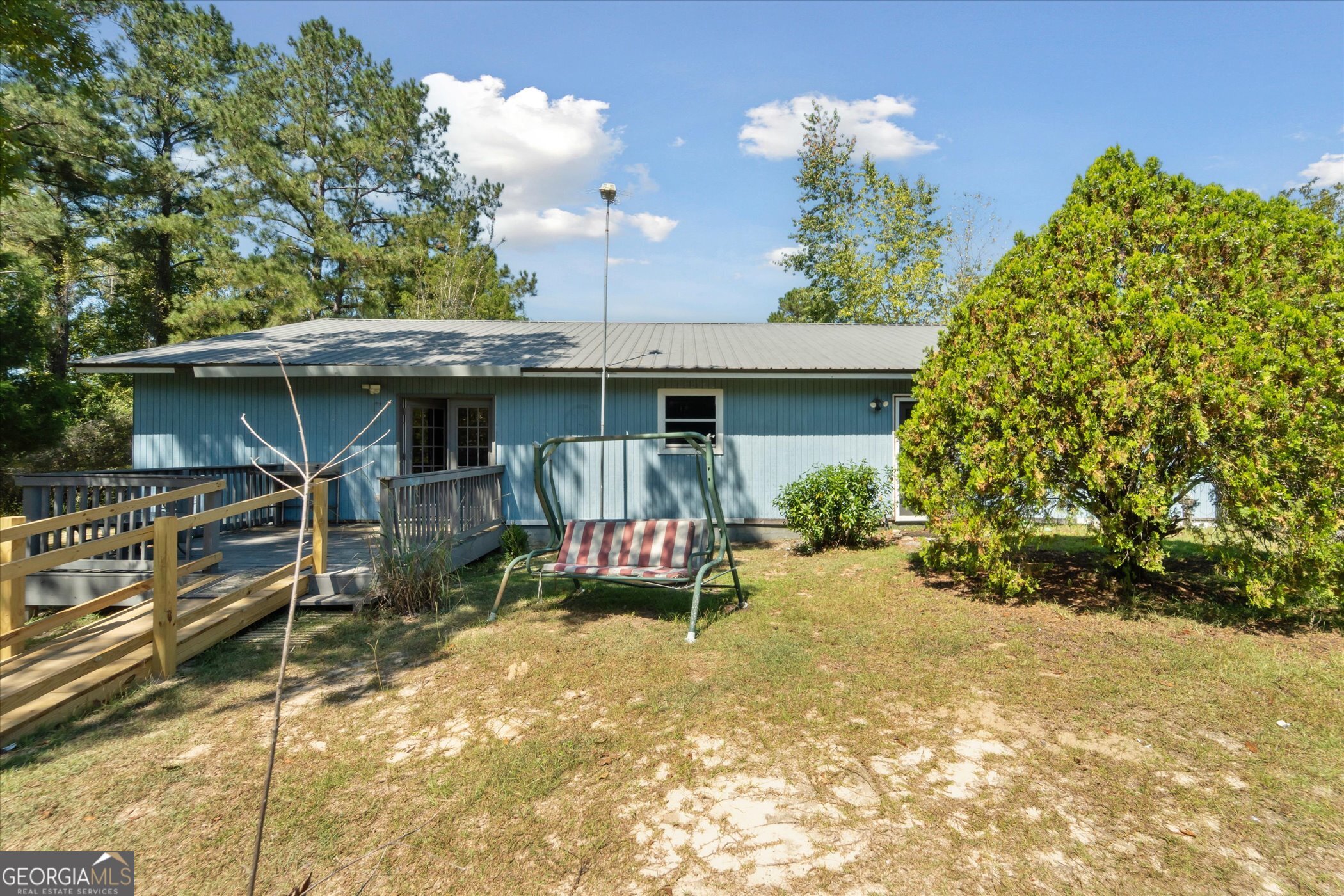 Discover the perfect blend of comfort and country charm with this 3 bedroom, 2 bath home on 8.64 acres! Tucked away in a quiet rural setting with river access, this property offers the peace and privacy you've been looking for. Step inside to a spacious open floor plan featuring a large kitchen with ample cabinetry, island, and separate dining area. Three generously sized bedrooms and two full bathrooms provide plenty of space for family or guests. You'll be sure to love the screened-in porch overlooking the peaceful scenery, the ideal spot for your morning cofee or relaxing evenings outdoors. With 8.64 acres of land, there's room to roam, garden, or simply enjoy nature right outside your door. There is also a single-wide mobile home on the property that could potentially be repurposed, offering endless possibilities. This amazing property is ready to be your personal retreat! Schedule your showing today.