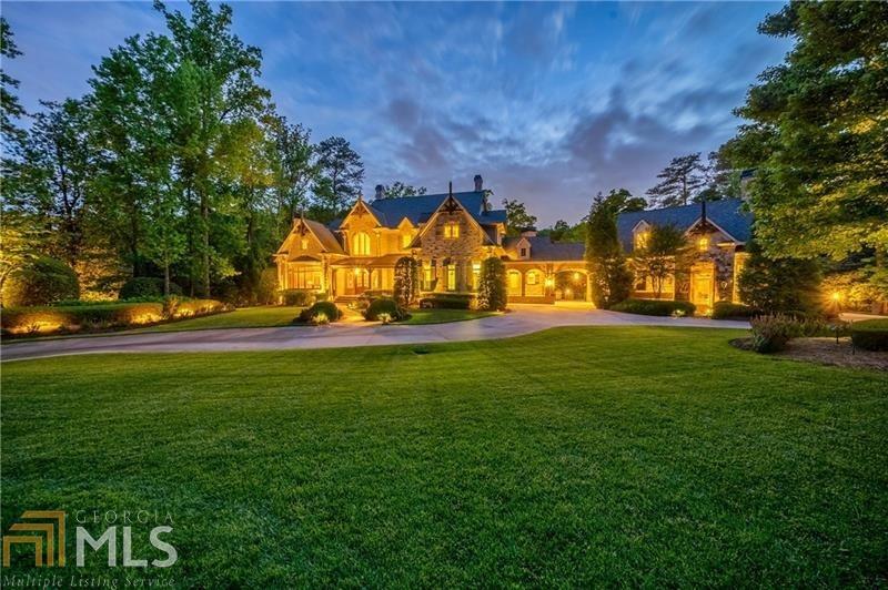 Private gated estate on 3.15 acres. Beautiful grounds offer resort-style outdoor living with covered patios and porches, an outdoor kitchen, heated pool & spa and outdoor fireplace. Grand entrance with sweeping staircase leads to an open floor plan with large rooms and high ceilings, perfect for entertaining. Stunning, Great Room, limestone fireplace, coffered ceiling, and wall of windows with glass doors leading to the covered veranda. Gourmet Kitchen which opens to the Light-Filled Keeping Room. Luxurious main level master suite with fireplace, morning bar and sitting area. Closet to die for.. Spa master bathroom with double vanities, large walk-in shower and soaking tub. Upstairs boast 4 ensuite bedrooms and large family room. Huge Terrace Level with theater, billiards area,bar, recreation room,craft room, bedroom and gym, sauna, steam room and more. Separate au pair apartment with kitchen, sitting area, bedroom and full bathroom.(Au Pair apartment not counted in the bedroom count) Mature landscaping throughout and level manicured grassy areas perfect for a game of soccer. The heated saltwater pool features a water-slide and large sunbathing area. whole house generator, well, Parking for 20+ cars. Elevator Company confirmed that there is a spot to add an elevator.