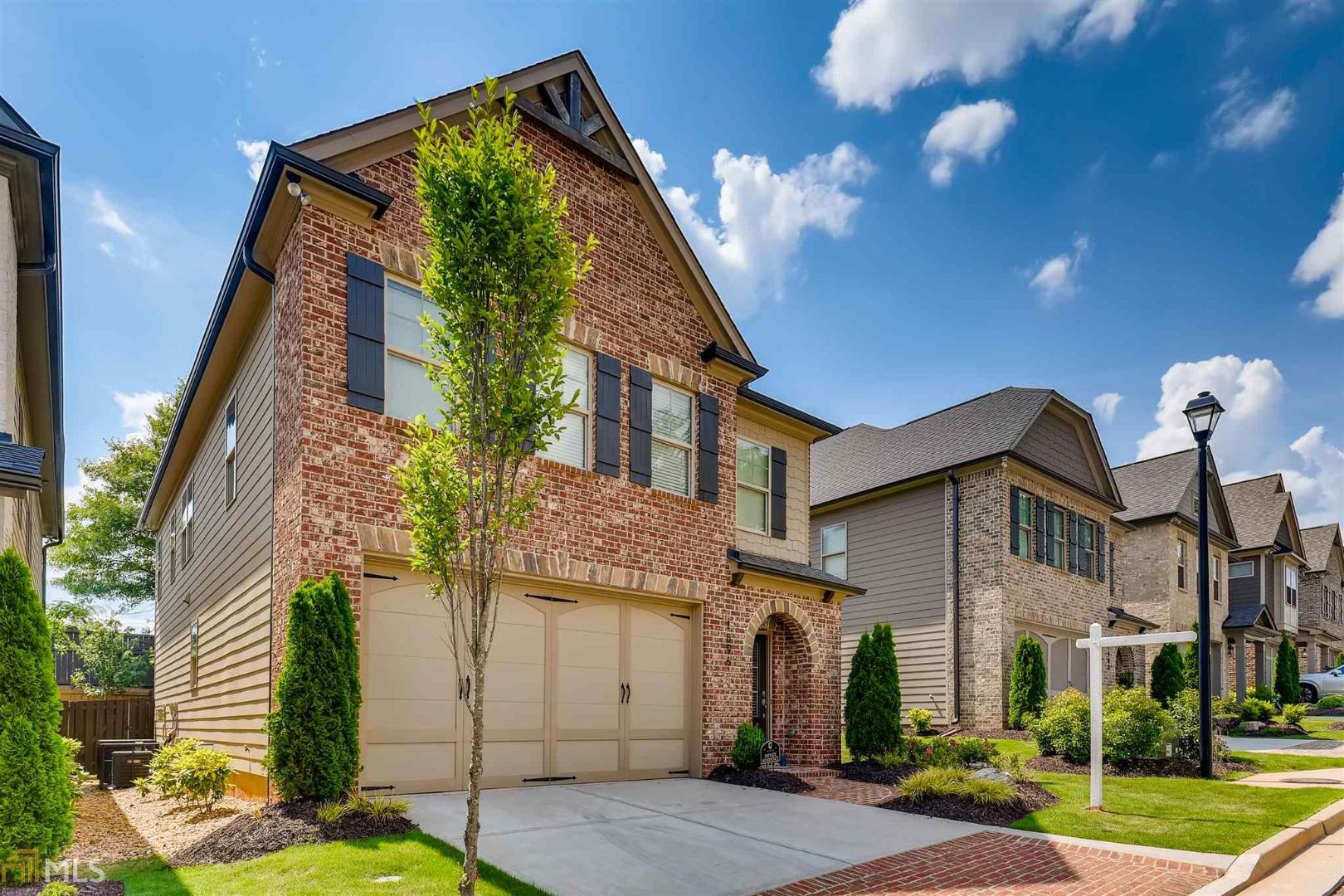 Impressive like new spacious traditional in convenient Weston. 40K under similar home in community! Has beautiful upgraded espresso hardwoods throughout main level and upstairs, oversized chef's kitchen with grey/blue cabinets, quartz counters, and oversized island. Home features stainless appliances, custom pendant lighting & additional serving area providing extra counter space and storage. Separate gas cooktop w/vent hood and walk-in pantry. French country inspired family room w/ceiling with exposed beams and extra seating area. Custom brick fireplace with wood mantel in great room. Four large bedrooms are upstairs, including a guestroom with ensuite bath and walk-in closet Master suite boasts double trey ceilings, fan and large walk-in closet. Gorgeous master spa w/tiled glass shower, garden tub, double vanities and tiled flooring. Owner has outfitted home with blinds, new refrigerator and perfect garage epoxy flooring. Private backyard porch and patio with grassed area for pets.Home has barely been lived in and has many upgrades that were not standard in new homes. Fantastic Gated Community w/Pool. Owner has outfitted home with blinds, new refrigerator and perfect garage epoxy flooring. Private backyard porch and patio with grassed area for pets.Home has barely been lived in and has over 20k in upgrades that were not standard in new homes. Priced under other homes and has many more upgrades!