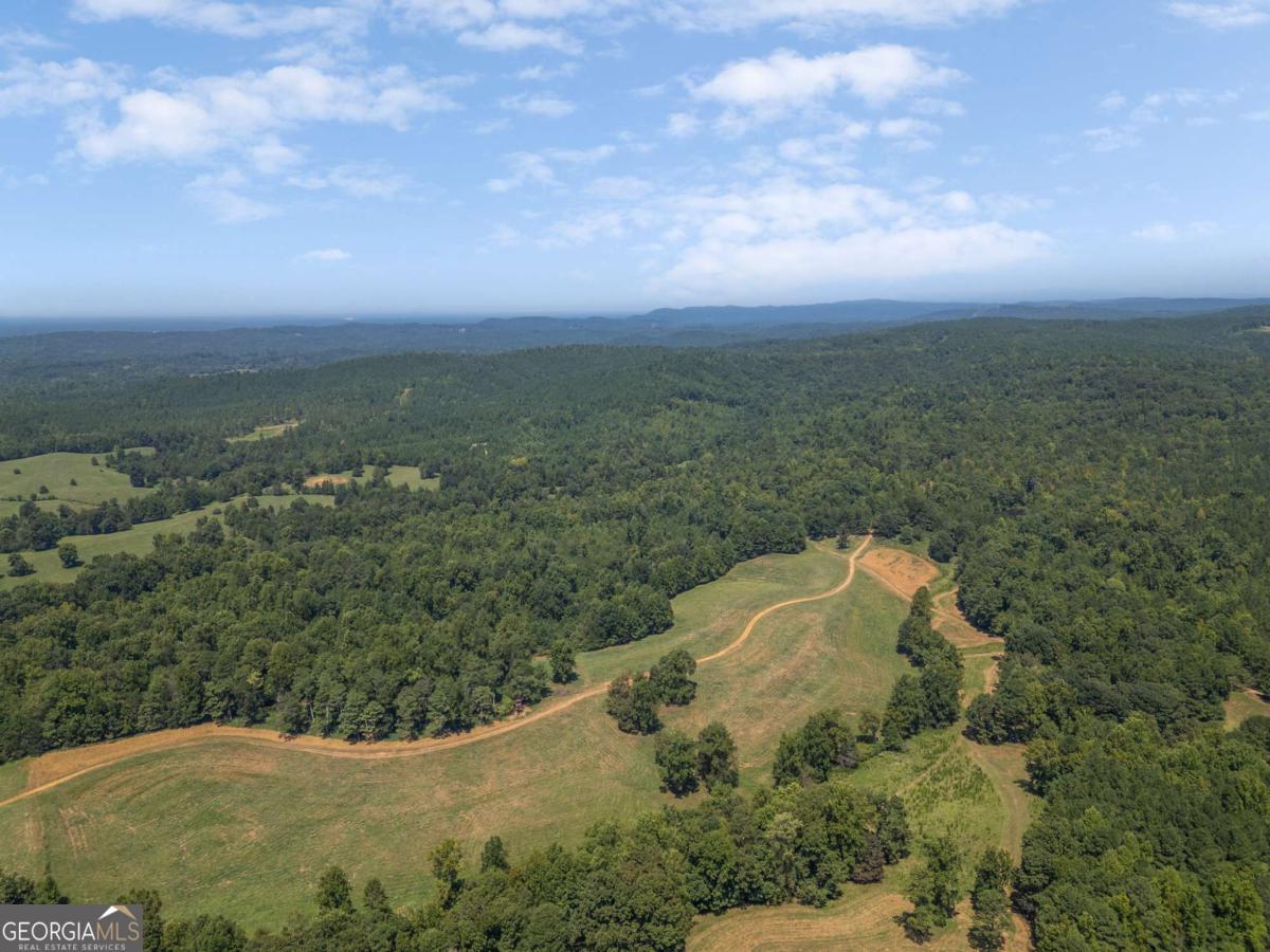 One of a kind property available in Cherokee county. 184 acres with approximately 60 acres of pasture with hay production. Could be split roughly in half. Truly one of the most beautiful pieces of property in all of Cherokee County! Long range views, pasture, mature hardwoods. Previously a cattle farm. Established trails for horseback riding and recreational use. Beautiful mature hardwoods. One acre pond for fishing. Incredible hunting on property with deer, turkey, bear and hogs. Would make a beautiful family compound, horse farm or recreational piece. Currently used for hay production and hunting.