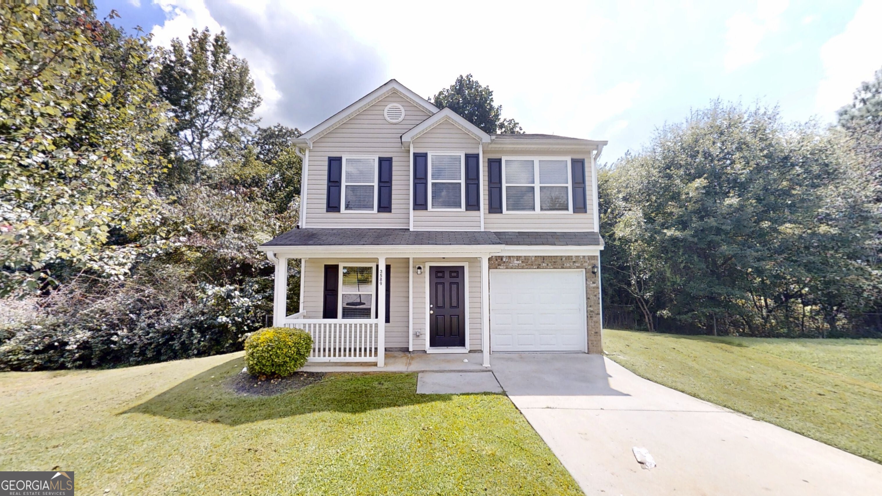 Welcome home!! This well-maintained 3 bedroom, 2.5 bath home in Brookstone is move-in ready! Fresh paint throughout gives the home a bright, updated feel. The main level features easy-care tile flooring in all living and wet areas, while plush carpet adds comfort upstairs. Enjoy a cozy family room with a gas log fireplace perfect for relaxing evenings. The kitchen offers white cabinetry, stone countertops, and stainless steel appliances, making it both stylish and functional. The spacious primary suite features a large bedroom and en suite bath, offering a comfortable retreat. Step outside to a rear deck, ideal for entertaining or enjoying quiet evenings outdoors. Located just minutes from shopping, dining, and quick access to I-85, this home offers the perfect blend of comfort and convenience.