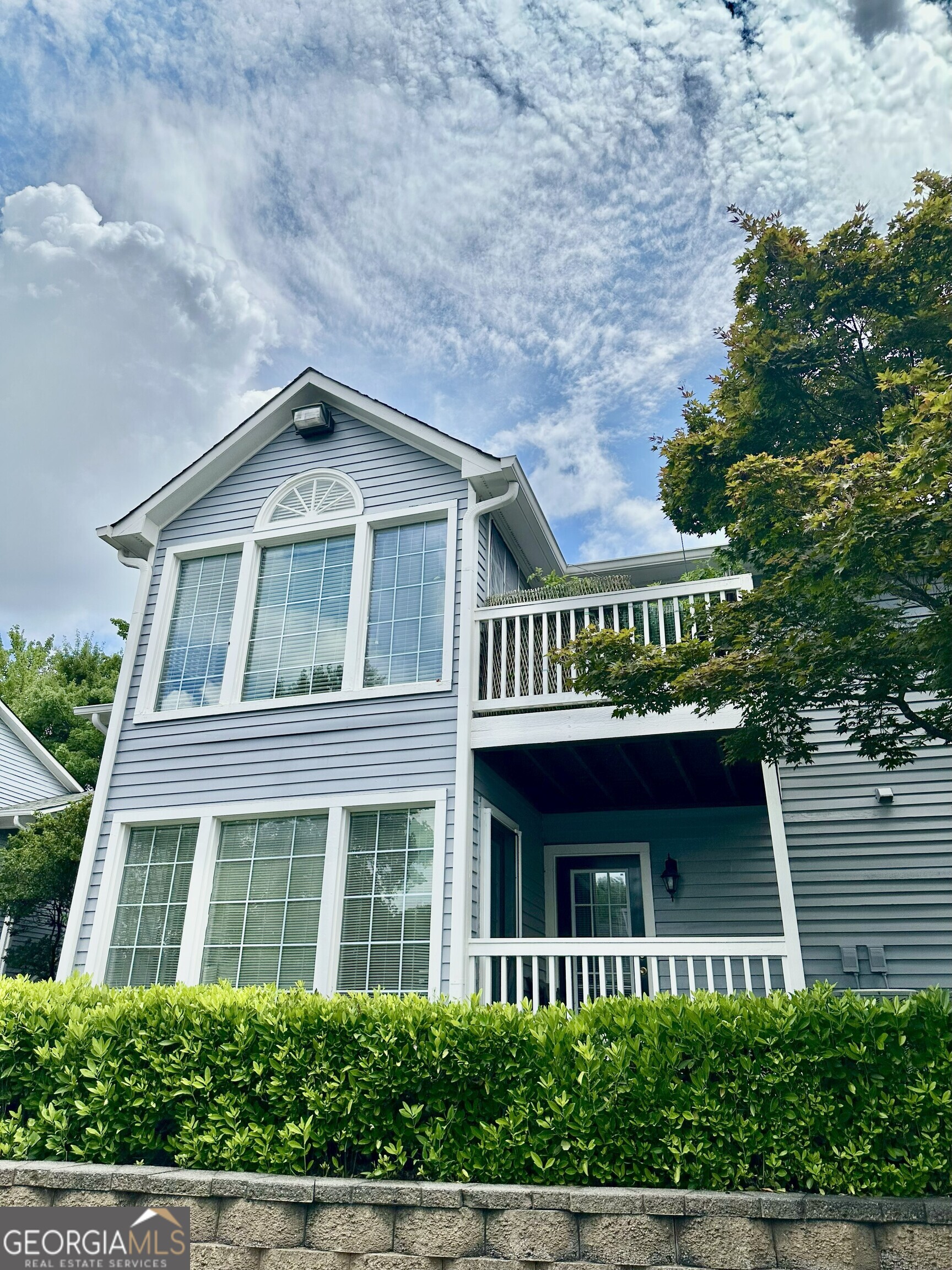If you are looking for peace and tranquility, look no further! This desirable, move-in ready, cozy, corner unit offers added privacy and beautiful greenery with the community pool just steps away. The open-concept layout features a welcoming living area with a cozy fireplace, a separate dining room perfect for entertaining, and not one-but two entrances to the private balcony, one of which is accessible directly from a bedroom. Bright and airy throughout, this home blends comfort with convenience. The secondary room is versatile and roomy-perfect for the children, a home office, creative studio, or guest space. Centrally located right off of Hwy 285 & 85, the ease of access is like none other. Local dining, nearby schools, shopping and everyday essentials are all just moments away. Don't miss out, schedule your tour today!