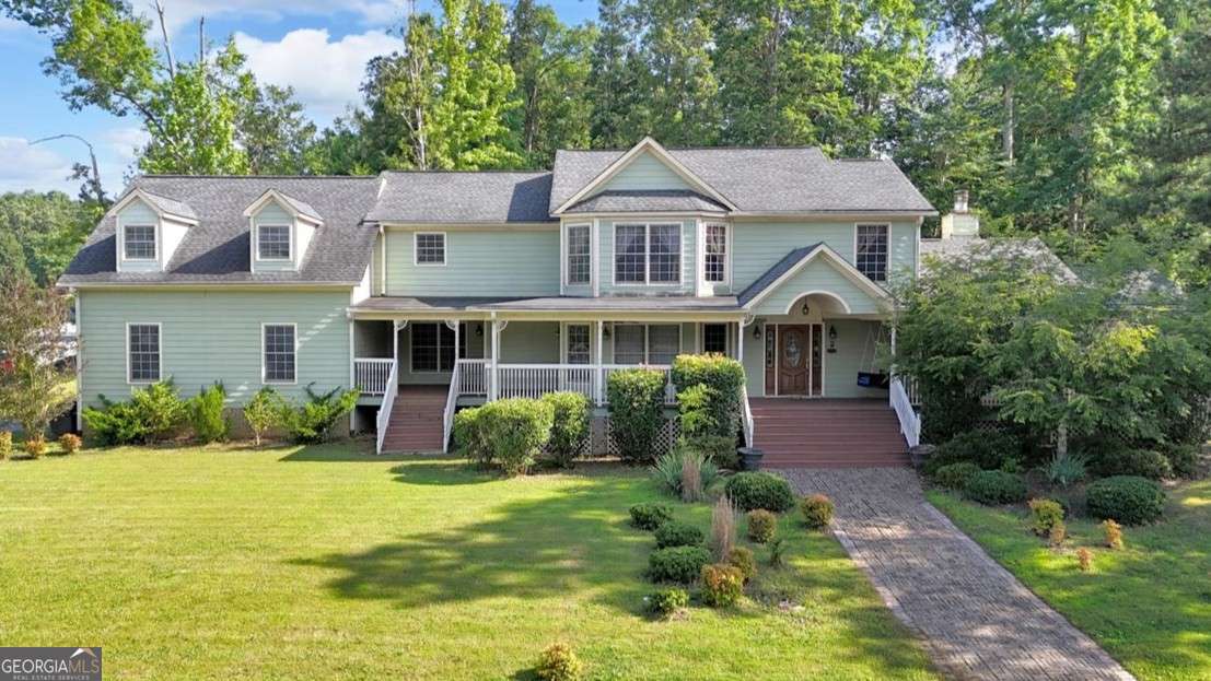 Spacious 4-bedroom, 3.5-bath home on a corner lot in Mountain Brook West! Relax on the charming covered front porch, perfect for summer evenings. The main level features a large kitchen with ample counter space, a dining room with new wood floors, a cozy living room with fireplace, French doors to the back patio, 2 bedrooms with Jack-and-Jill bath, half bath, and laundry room. Upstairs, the master suite offers a sitting area, spa-like bath with separate tub and shower, and a huge walk-in closet. A second upstairs space includes an additional bedroom, kitchen, and full bath-ideal for guests or multigenerational living. The fenced backyard boasts a large patio and plenty of room for pets or play. Plus, an oversized 2-car garage provides excellent storage and workspace. Don't miss out-schedule your private showing today!