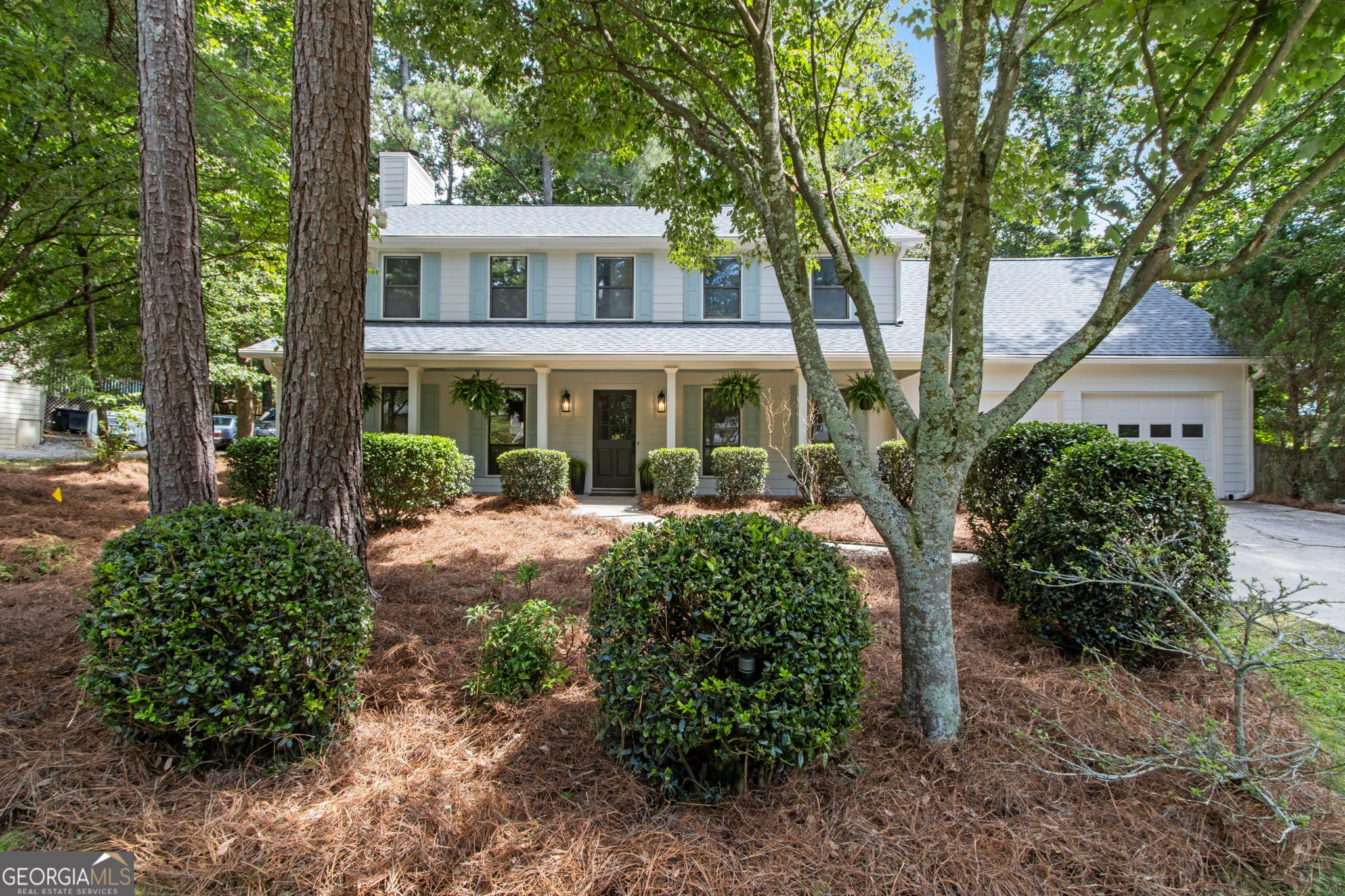Prepare to be impressed by this stunning, newly renovated home located in a highly sought-after, family-friendly Roswell neighborhood. Expertly reimagined by Copernicus Home Creations, Inc., this classic residence is a true showstopper, featuring thoughtful design, high-quality materials, and numerous custom upgrades throughout. From the moment you step inside, you'll be captivated by the light-filled, airy, and spacious interior. The home boasts fresh interior and exterior paint, a brand-new roof, and beautiful, new hardwood floors throughout. The open-concept living room is exceptionally spacious and features a stylish fireplace, a custom-built in bar area, and direct access to a cozy sunroom-ideal for relaxing or entertaining. The elegant dining room, located just off the kitchen, showcases detailed custom millwork. At the heart of the home is a chef's dream kitchen, complete with rich stained cabinetry, quartz countertops, a matching backsplash, stainless steel appliances, a large center island, under-cabinet lighting, and eye-catching designer fixtures. Don't miss the stylish powder room on the main level, another standout detail of this home. Upstairs, you'll find three spacious bedrooms and two beautifully designed bathrooms, including an expansive primary suite. The primary bedroom offers French door access to a luxurious en-suite bath featuring a double vanity with stained cabinetry, high-end tile finishes, and a generous zero-entry frameless glass shower. A custom walk-in closet completes the suite, equipped with ample hanging space, drawers, and dedicated shoe storage-perfect for any wardrobe enthusiast. Above the garage is a private guest suite with its own full bath and stepless shower-ideal for guests, a home office, or multigenerational living. The backyard offers low-maintenance landscaping, a charming patio off the kitchen, and access to the sunroom-perfect for enjoying indoor-outdoor living. Located in Woodfield, an active swim/tennis community, this home enjoys close proximity to East Roswell Park, premier shopping, dining, and entertainment. This is a must-see property that blends comfort, style, and function-schedule your private tour today!