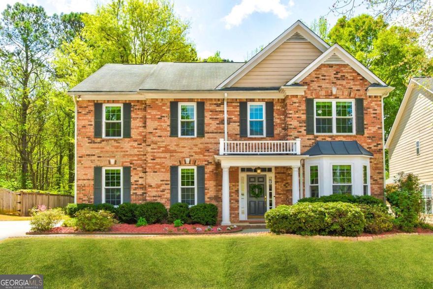 Beautifully updated 4-bedroom, 3.5-bath John Wieland home located in a quiet cul-de-sac in the highly sought-after East Cobb area. Zoned for top-rated schools, this move-in ready property offers a spacious, open floor plan with 3,349 square feet of living space.    The main level features luxury plank flooring, fresh carpet, and large windows that fill the home with natural light. The family room includes custom built-in shelving and a gas fireplace, flowing seamlessly into the open kitchen with a large center island and ample cabinetry-perfect for everyday living and entertaining.    Upstairs includes an oversized bonus room and a renovated primary suite with a spa-like bathroom featuring a walk-in shower, soaking tub, and walk-in closet. Enjoy outdoor living on the covered back patio overlooking a level, private backyard that backs to woods for added privacy.    Community amenities include a playground, green space, and walking trail with access to the Holly Springs swim and tennis facilities (optional membership). HVAC systems, furnace, and water heater have all been recently replaced-truly a turnkey home.