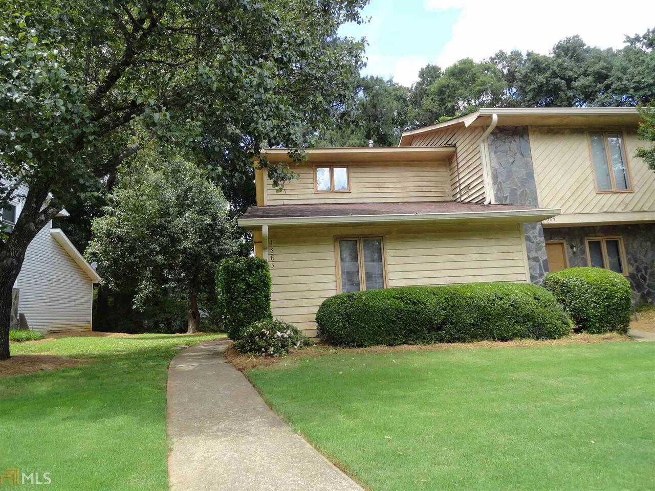 Heart of Smyrna yet this cul de sac is off beaten path- End unit with private yard on the side and in back ready for July 16 move in-Lots of wood floors on main level and soaring ceilings as well 20' high with lots of clerestory windows-Great room has fireplace that extends up to 2nd floor-Step saver kitchen for those who hate to cook and breakfast bar that overlooks dining room so you can stay out of the kitchen- Roommate plan with bedroom and full bath on each level-Trash and yard maintenance included in rent