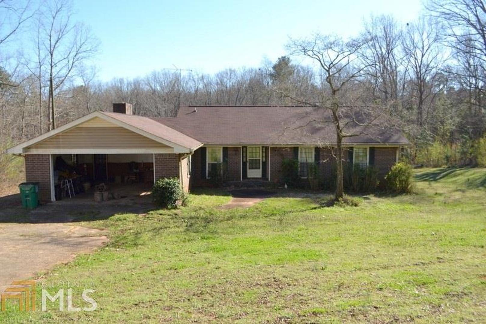 RANCH HOME ON 15.67 ACRES! HUGE BUILDING THAT HAS 3 OVERSIZED GARAGE DOORS THAT IS PERFECT FOR WORKING ON CARS OR TO BE USED AS A WORKSHOP. THE BUILDING HAS POWER AND WATER. IN THE HOME, THE SPACIOUS FOYER HAS BUILT IN BOOKCASES. THE LIVING ROOM IS OPEN TO THE DINING AREA. GREAT SIZE KITCHEN WITH A HUGE BREAKFAST AREA THAT IS OPEN TO THE FAMILY ROOM WITH ROCK FIREPLACE. MORE STORAGE ROOM IS AVAILABLE IN THE UNFINISHED BASEMENT WITH BOAT DOOR. THE ROOF IS LESS THAN 5 YEARS OLD.