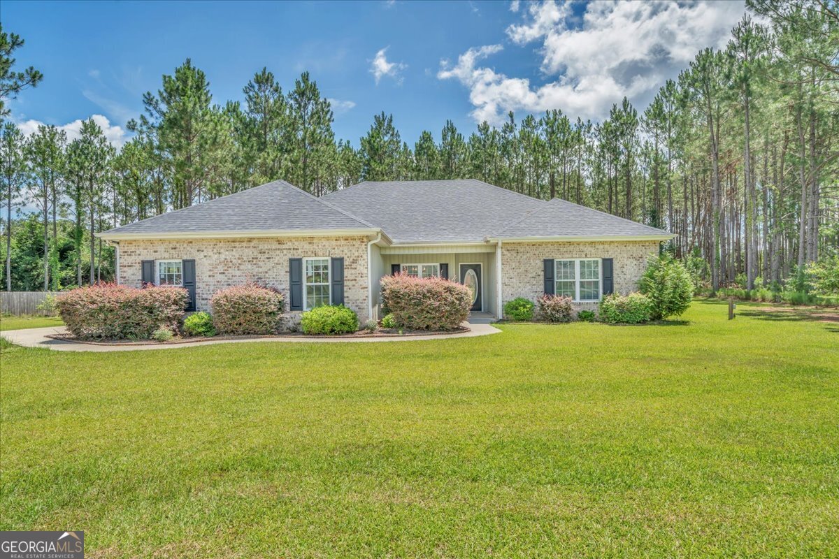 Like-New 4 Bedroom, 2 Bath Home with Open Split Floor Plan! Built in 2019 and meticulously maintained, this 1,877 sq. ft. home offers modern comfort and functionality in a beautifully designed open split floor plan. The spacious primary suite is a true retreat, featuring a fabulous en-suite bath and generous closet space. The kitchen is the heart of the home, complete with a large island with seating, and ample cabinetry-perfect for both everyday living and entertaining. Enjoy relaxing mornings on the welcoming front porch, peaceful evenings in the screened-in porch, or host gatherings on the back patio. This home combines style, space, and convenience in every detail. Move-in ready and like new-don't miss this opportunity!