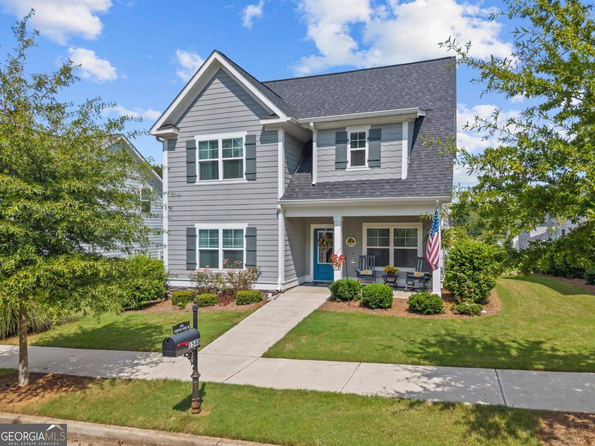 Welcome to this beautifully kept, nearly-new home located in the sought-after Carriage Ridge neighborhood of Harbor Club! Built just four years ago, this spacious residence offers 4 bedrooms and 3.5 bathrooms, with the primary suite and a dedicated office conveniently situated on the main level. Upstairs hosts three additional bedrooms, two full baths, and a versatile loft area. Oversized laundry room with full wall storage. Thoughtful upgrades throughout, including elegant coffered ceilings in both the great room and office/den, as well as an inviting open-concept layout. The kitchen is a standout with its generous counter space and oversized walk-in pantry. Relax on the covered front or back porch and enjoy the peaceful surroundings and wave to friendly neighbors. Carriage Ridge includes landscape maintenance as part of the annual fees. Carriage Ridge is known for being a tight-knit community where neighbors often gather for their own events and get-togethers. Just a short stroll away is The Grove, featuring a fitness center, pickleball courts, walking trails, dog parks, and a community garden. Harbor Club offers variety of membership options for access to golf, lake activities, dining, and a vibrant social scene-everything you need to embrace the lake and club lifestyle!