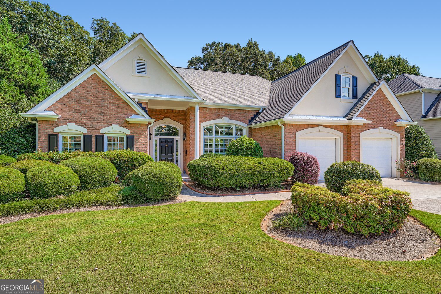 Welcome to this beautifully updated home in sought-after Forsyth County! This property is move-in ready with brand-new carpet, fresh exterior paint, new hardwood floors, and updated light fixtures throughout. The primary suite is conveniently located on the main level, along with two additional bedrooms. The renovated master bath and secondary bath bring a fresh, modern feel. Upstairs, enjoy a private guest suite with full bath, perfect for visitors or extended family. The home features a large dining area, a spacious office, and a kitchen with stainless steel appliances and granite countertops. Outside, there is a garden area with butterfly bushes, adding charm to the property. Community amenities include a playground, swimming pool, and tennis courts. With top-rated Forsyth County schools and easy access to GA-400, this home offers comfort, convenience, and value.
