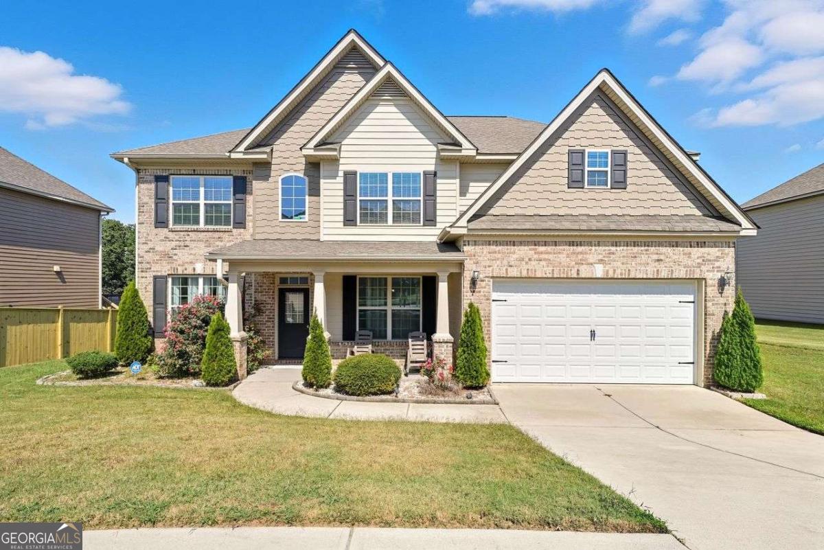 This spacious 5-bedroom, 3-full-bath home offers comfort, style, and room for everyone. Step inside to discover an inviting floor plan featuring beautiful coffered ceiling in the dining room, flex room with French doors and a bright and open living area with lots of natural light, great for entertaining or relaxing with loved ones. The kitchen is designed for both functionality and gatherings, flowing seamlessly into family room. With five generously sized bedrooms, including a luxurious owner's suite with a fireplace, and enjoyable media room, there's plenty of space for rest, work, or play. The three full baths ensure convenience and privacy for loved ones and guests alike. Outside, enjoy a spacious backyard with space for outdoor dining, play, or quiet evenings at home. Conveniently located near shopping, dining, schools, and parks, this home combines suburban comfort with everyday convenience. Don't miss the opportunity to make this beautiful Lawrenceville property your next home!