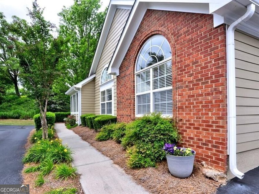 Welcome to this lovely community filled with charm and friendliness all around! Imagine no more yard work or outside maintenance. This condo is in a great location within the community, with close proximity to the community mailbox and the clubhouse and pool. This community is close to I-575 and I-75, Kennestone Hospital, doctor facilities  and Town Center Mall. For your convenience there is a sidewalk from the Vintage Club to Publix, Barnes & Noble, restaurants and much, much more! The open concept of this condo allows for a view from the kitchen to the great room, dining room and sun room. Stone counter tops in the kitchen and master bath. The laundry room is just off the kitchen, along with a large pantry. New roof in 2020 and the HVAC and hot water heater are approx. 6 years old. Enjoy Noonday Creek Trail, just one block away, which has a walking trail and bikes for your enjoyment!