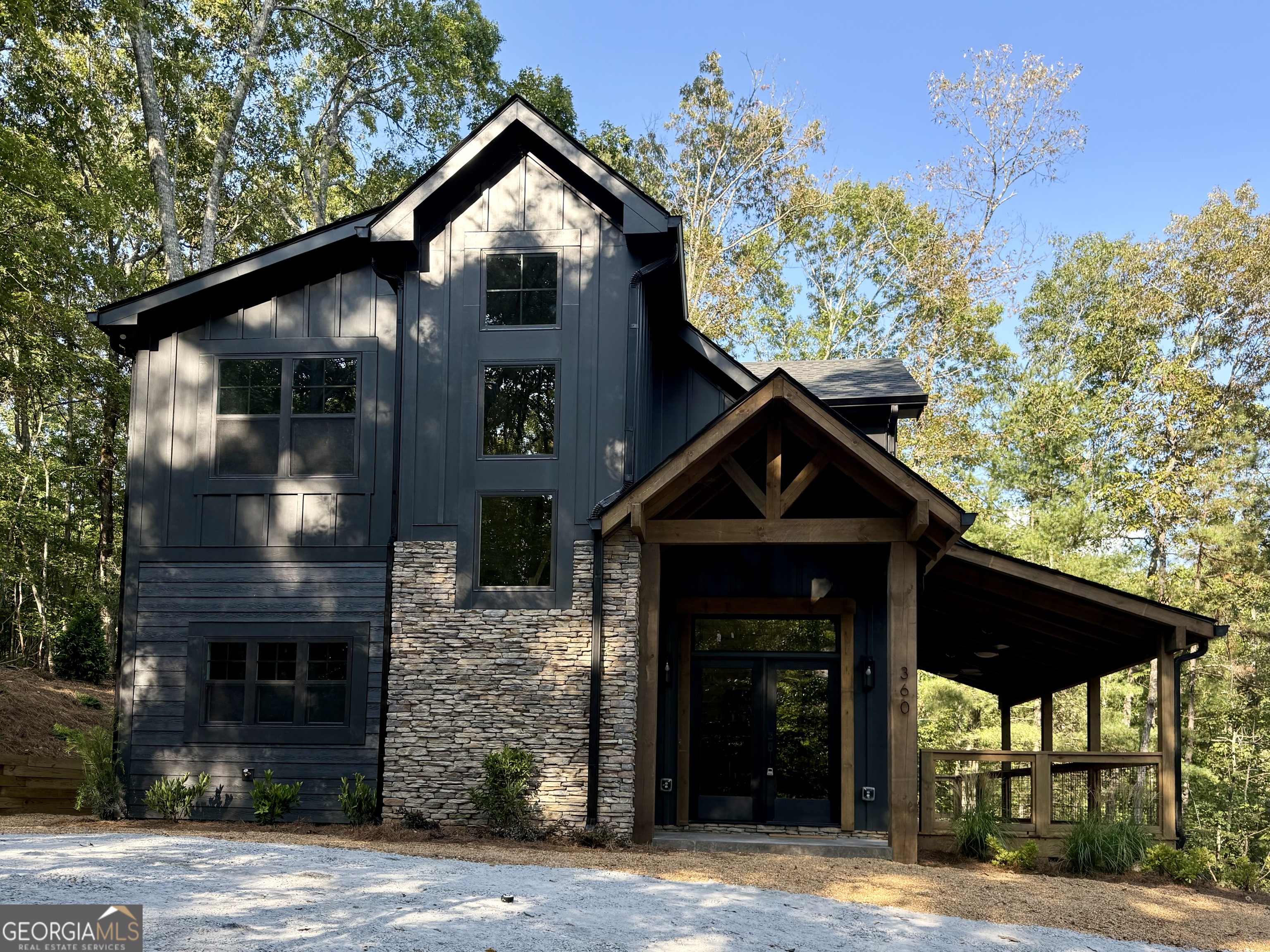 Modern Craftsman meets Mountain Luxury in this rustic chic retreat! Experience refined mountain living in this stunning 3BR/2.5BA home, thoughtfully designed to blend clean architectural lines with natural elements. Set in the heart of the North GA Mountains, this new construction opportunity dream retreat is in one the region's most sought after, gated resort communities. this home sits a short distance inside the gate on a paved road. Coosawattee River Resort provides easy access to Jasper, Ellijay, and Blue Ridge, with hiking, mountain biking, wineries, shopping, and dining all nearby! Community amenities include gated entries, nature trails, river access, outdoor pavilion and playground, 2 outdoor pools, and rec center with indoor pool, game room, fitness center, tennis, and pickleball. This stunning home is perfect as your primary residence, a vacation getaway, or an excellent addition to your investment portfolio. This home is finished and ready for you to call home. This IS the mountain lifestyle you have been dreaming of!