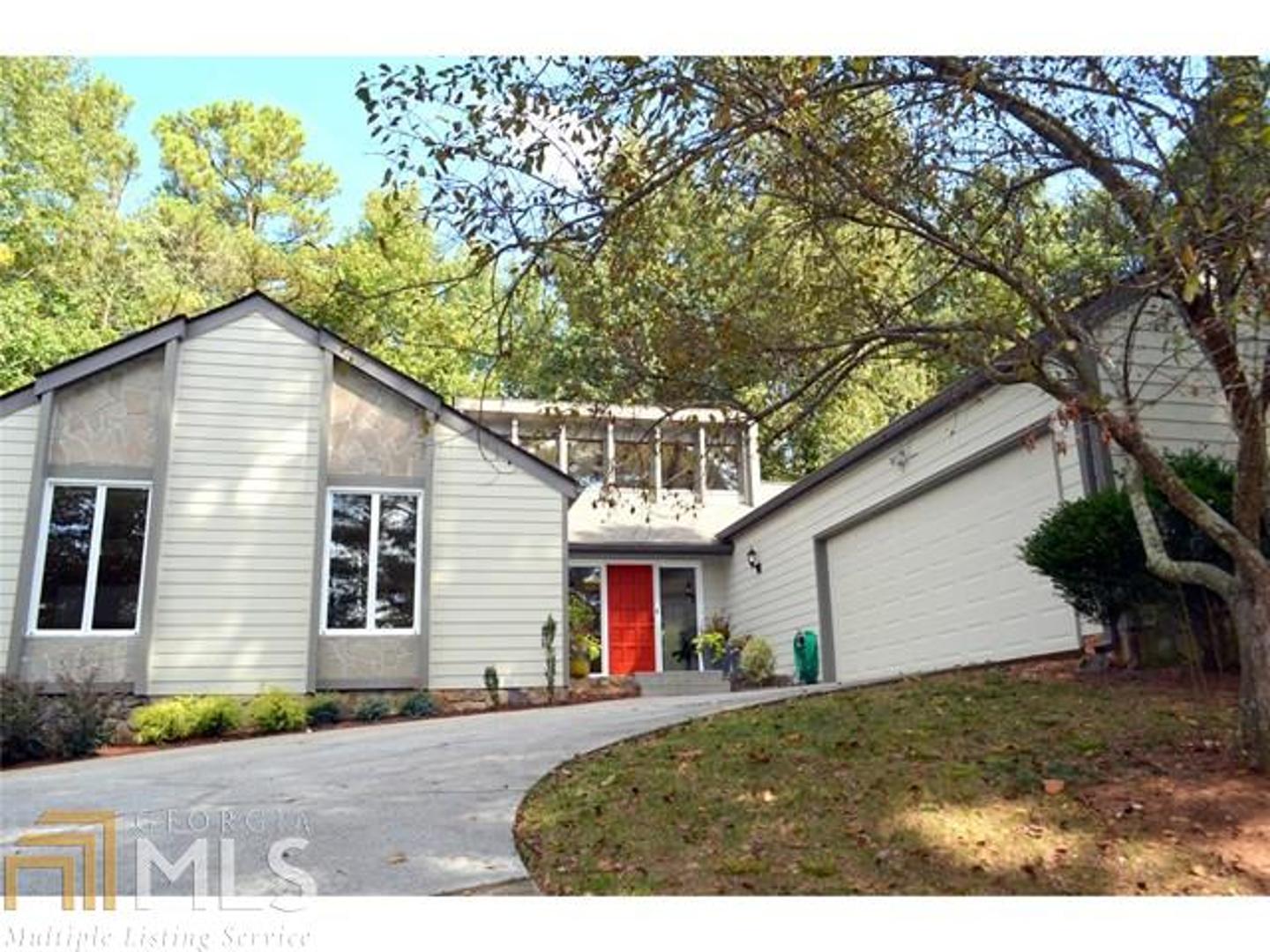 Awesome contemporary in Duluth! Walk to downtown! Walk to school! Walk to swim/tennis/park/lake! This adorable home features: new siding, new roof, new carpet, new paint, vaulted great room, lots of skylights bringing in natural light, a sunken fireside den overlooking private patio and backyard, formal dining w/ exposed beams and wet bar, large kitchen with new dishwasher/b'fast bar, bfast room overlooking sep private deck -also with skylights, all bedrooms are large, superb landscaping, well maintained - and all located on cul de sac in a great school district!