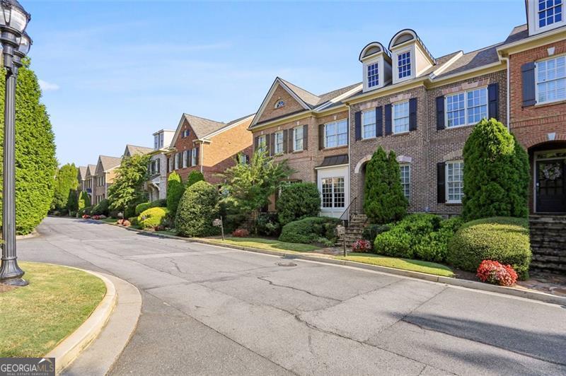 Experience timeless sophistication in this luxurious townhome, just minutes from the vibrant heart of Marietta. Thoughtfully designed with upscale finishes and architectural character throughout, this home exudes elegance - from its soaring ceilings and sun-drenched interiors to its seamless layout built for both comfort and style. The main level welcomes you with an open, flowing floor plan perfect for everyday living and entertaining. Enjoy meals in the formal dining area, cook with ease in the gourmet kitchen, unwind by the fireplace in the spacious family room, or relax in the bright study or on the covered deck. Upstairs, you'll find three generously sized bedrooms and two well-appointed bathrooms, including an exquisite Owner's Retreat. This serene space features a private sitting area, a custom coffee bar, a personal deck, and elegant finishes - your very own private getaway. The finished terrace level offers incredible flexibility with a full bathroom - ideal for a media room, home gym, game room, or guest suite. With designer upgrades throughout, this meticulously maintained home offers the perfect blend of luxury and convenience. Enjoy convenience to Kennesaw Mountain trails and easy access to shops, restaurants, theaters, the hospital, and I-75. **Additional highlights include a brand-new roof and two new HVAC systems.** Move-in ready and perfectly located, this is exceptional luxury living at an unbeatable value.