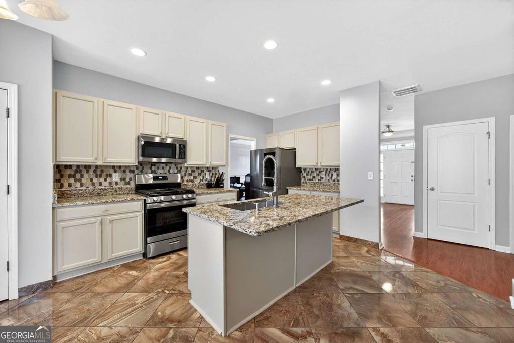 Photo of 1322 Melrose Woods Lane, Lawrenceville, GA 30045 (MLS # 10676972)